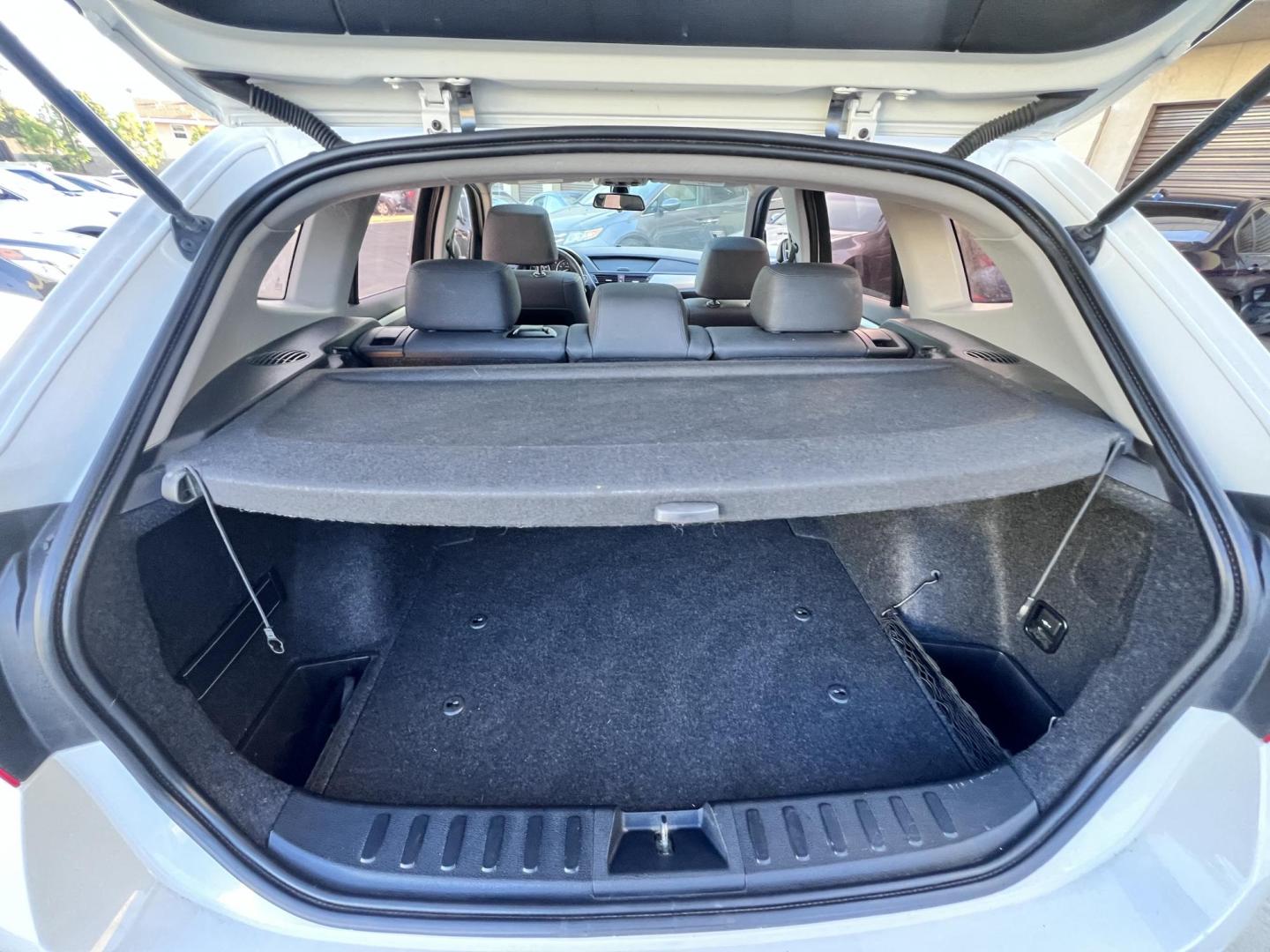 2014 White /beige BMW X1 sDrive28i (WBAVM1C50EV) with an 2.0L L4 DOHC 16V engine, 8-Speed Automatic transmission, located at 30 S. Berkeley Avenue, Pasadena, CA, 91107, (626) 248-7567, 34.145447, -118.109398 - Crown City Motors is a used “Buy Here Pay Here” car dealer in Pasadena CA. “Buy Here Pay Here” financing, means that when you purchase your vehicle from our dealership, that you make the payments to the dealership as well. We do not need the banks approval to get you approved for a used auto - Photo#16