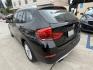 2014 Black /Black BMW X1 xDrive28i (WBAVL1C51EV) with an 2.0L L4 DOHC 16V engine, 8-Speed Automatic transmission, located at 30 S. Berkeley Avenue, Pasadena, CA, 91107, (626) 248-7567, 34.145447, -118.109398 - 2014 BMW X1 sDrive28i (Black on Black) – Pasadena Buy Here Pay Here | In-House Financing and Guaranteed Approval List Price: $7,795 | Dealer Document Fee: +$85.00 | Electronic Filing Fee: +$37.00 | Crown City Motors Price: $7,917 Drive today with bad credit, no credit, repossession, or bankr- Photo#2