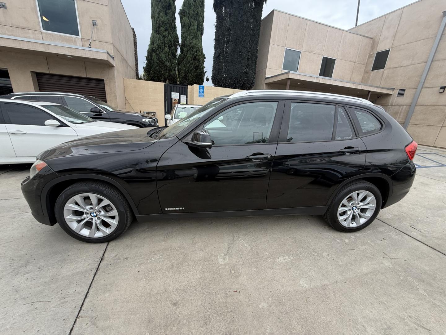 2014 Black /Black BMW X1 xDrive28i (WBAVL1C51EV) with an 2.0L L4 DOHC 16V engine, 8-Speed Automatic transmission, located at 30 S. Berkeley Avenue, Pasadena, CA, 91107, (626) 248-7567, 34.145447, -118.109398 - 2014 BMW X1 sDrive28i (Black on Black) – Pasadena Buy Here Pay Here | In-House Financing and Guaranteed Approval List Price: $7,795 | Dealer Document Fee: +$85.00 | Electronic Filing Fee: +$37.00 | Crown City Motors Price: $7,917 Drive today with bad credit, no credit, repossession, or bankr- Photo#1