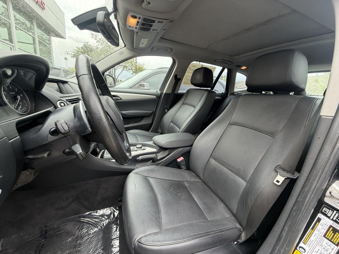 2014 Black /Black BMW X1 xDrive28i (WBAVL1C51EV) with an 2.0L L4 DOHC 16V engine, 8-Speed Automatic transmission, located at 30 S. Berkeley Avenue, Pasadena, CA, 91107, (626) 248-7567, 34.145447, -118.109398 - 2014 BMW X1 sDrive28i (Black on Black) – Pasadena Buy Here Pay Here | In-House Financing and Guaranteed Approval List Price: $7,795 | Dealer Document Fee: +$85.00 | Electronic Filing Fee: +$37.00 | Crown City Motors Price: $7,917 Drive today with bad credit, no credit, repossession, or bankr- Photo#7