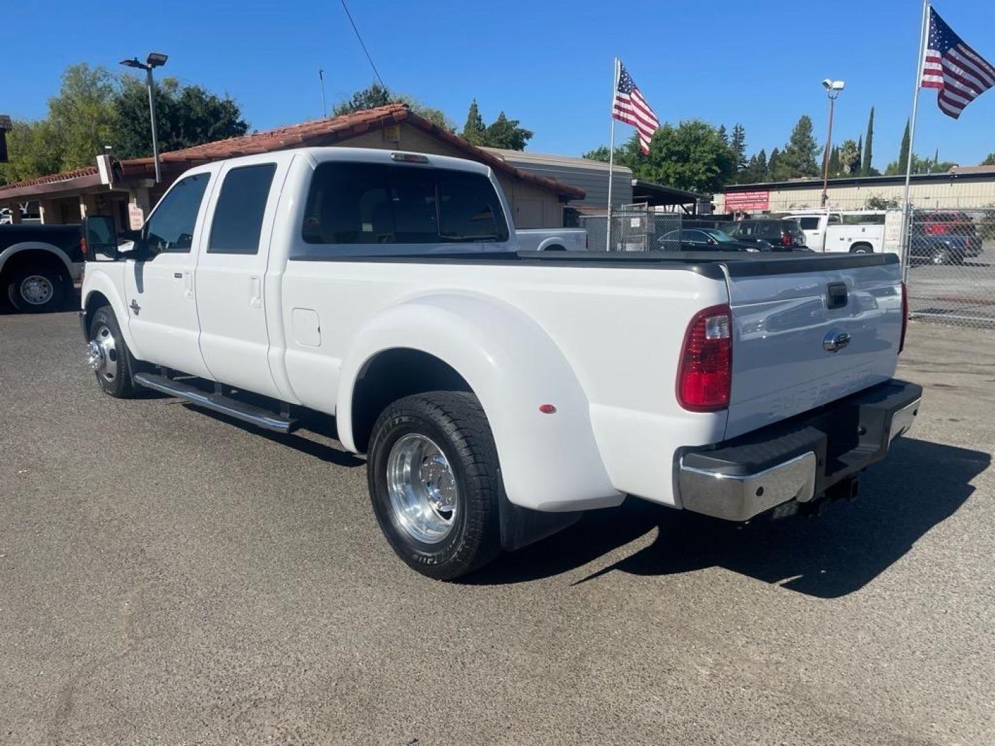 2014 Oxford White Ford F-350 Super Duty Lariat (1FT8W3CT8EE) with an 6.7L Power Stroke 6.7L Biodiesel Turbo V8 400hp 800ft. lbs. Common Rail Direct Injection engine, 6-Speed Shiftable Automatic transmission, located at 800 Riverside Ave, Roseville, CA, 95678, 916-773-4549 & Toll Free: 866-719-4393, 38.732265, -121.291039 - DIESEL CREW CAB DUALLY LARIAT SERVICE RECORDS ON CLEAN CARFAX - Photo#2