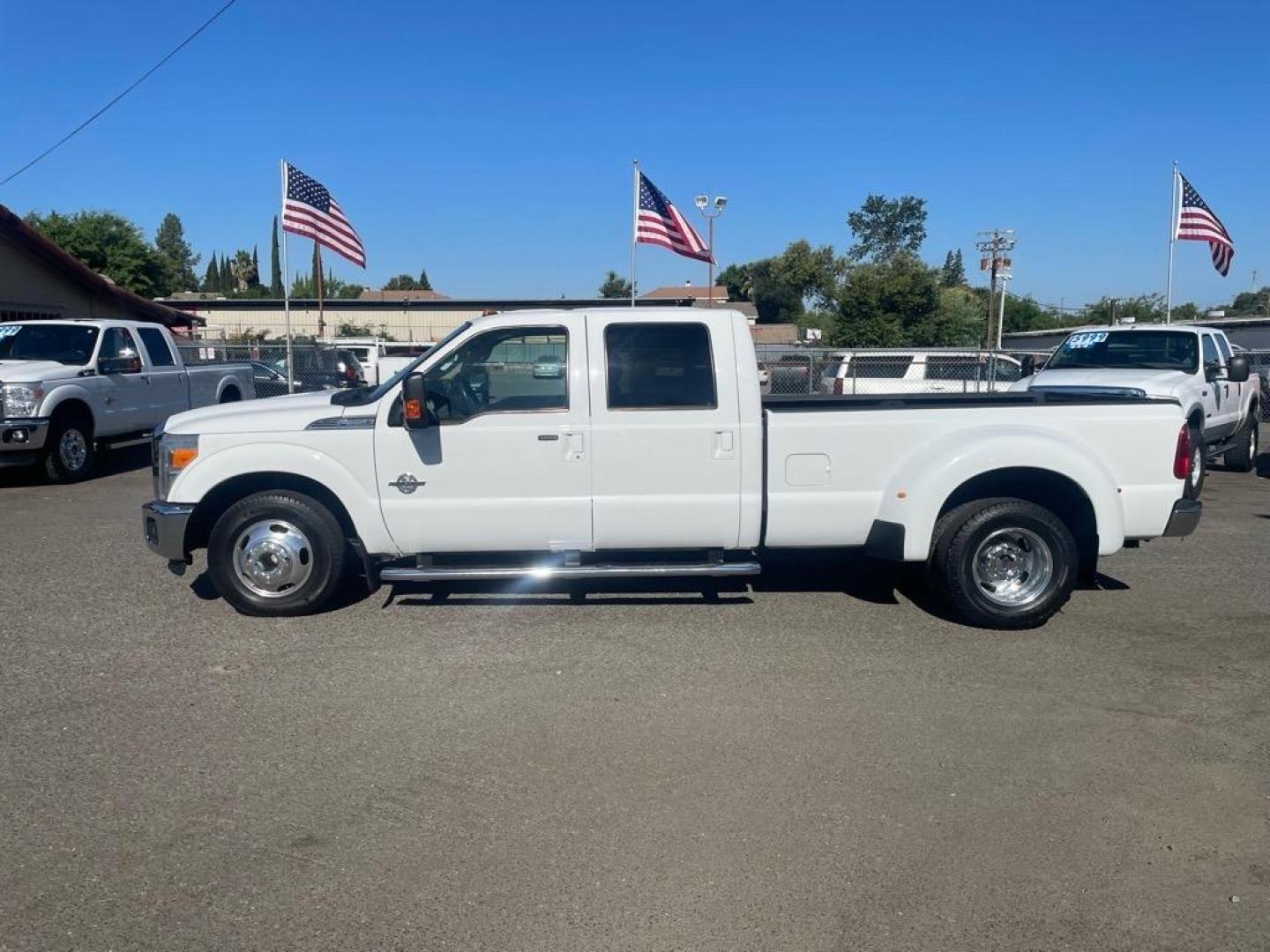 2014 Oxford White Ford F-350 Super Duty Lariat (1FT8W3CT8EE) with an 6.7L Power Stroke 6.7L Biodiesel Turbo V8 400hp 800ft. lbs. Common Rail Direct Injection engine, 6-Speed Shiftable Automatic transmission, located at 800 Riverside Ave, Roseville, CA, 95678, 916-773-4549 & Toll Free: 866-719-4393, 38.732265, -121.291039 - DIESEL CREW CAB DUALLY LARIAT SERVICE RECORDS ON CLEAN CARFAX - Photo#4