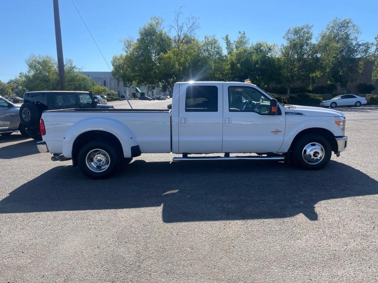 2014 Oxford White Ford F-350 Super Duty Lariat (1FT8W3CT8EE) with an 6.7L Power Stroke 6.7L Biodiesel Turbo V8 400hp 800ft. lbs. Common Rail Direct Injection engine, 6-Speed Shiftable Automatic transmission, located at 800 Riverside Ave, Roseville, CA, 95678, 916-773-4549 & Toll Free: 866-719-4393, 38.732265, -121.291039 - DIESEL CREW CAB DUALLY LARIAT SERVICE RECORDS ON CLEAN CARFAX - Photo#5