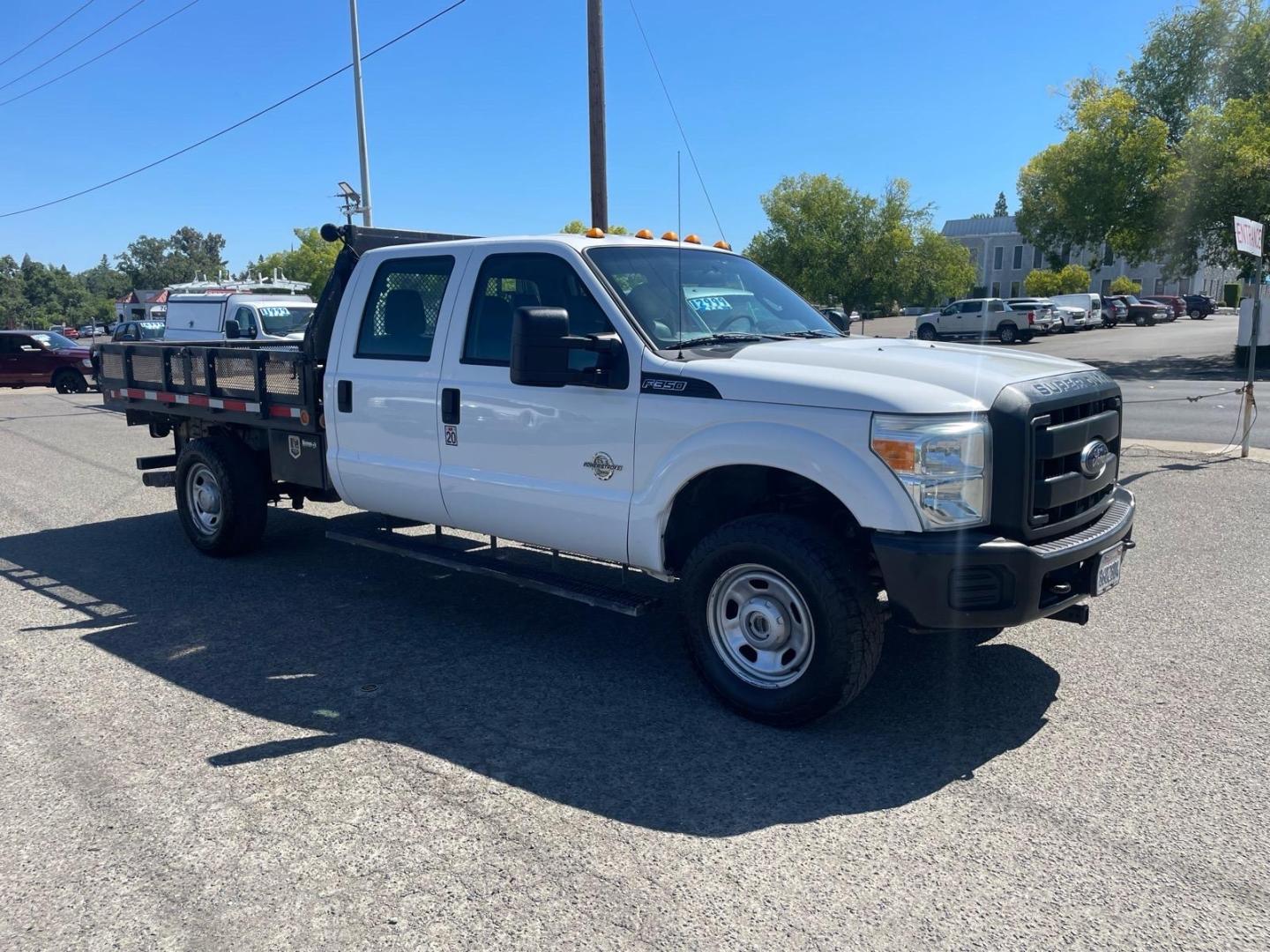 2014 White Ford F-350 Super Duty XL (1FD8W3FTXEE) with an 6.7L Power Stroke 6.7L Biodiesel Turbo V8 300hp 660ft. lbs. Common Rail Direct Injection engine, 6-Speed Shiftable Automatic transmission, located at 800 Riverside Ave, Roseville, CA, 95678, 916-773-4549 & Toll Free: 866-719-4393, 38.732265, -121.291039 - DIESEL CREW CAB 4X4 9 FOOT FLATBED ONE OWNER SERVICE RECORDS ON CLEAN CARFAX- Photo#1