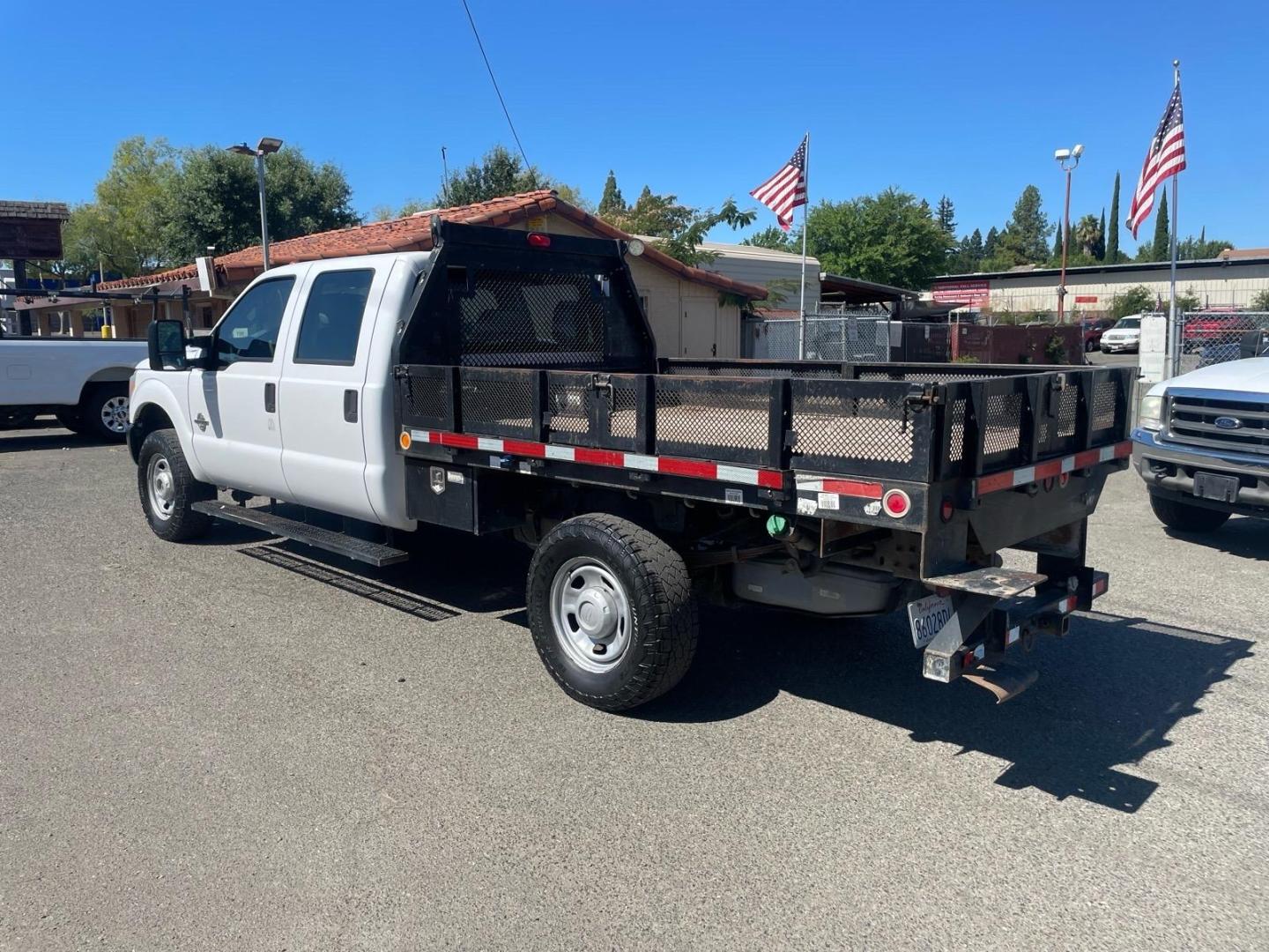 2014 White Ford F-350 Super Duty XL (1FD8W3FTXEE) with an 6.7L Power Stroke 6.7L Biodiesel Turbo V8 300hp 660ft. lbs. Common Rail Direct Injection engine, 6-Speed Shiftable Automatic transmission, located at 800 Riverside Ave, Roseville, CA, 95678, 916-773-4549 & Toll Free: 866-719-4393, 38.732265, -121.291039 - DIESEL CREW CAB 4X4 9 FOOT FLATBED ONE OWNER SERVICE RECORDS ON CLEAN CARFAX- Photo#2
