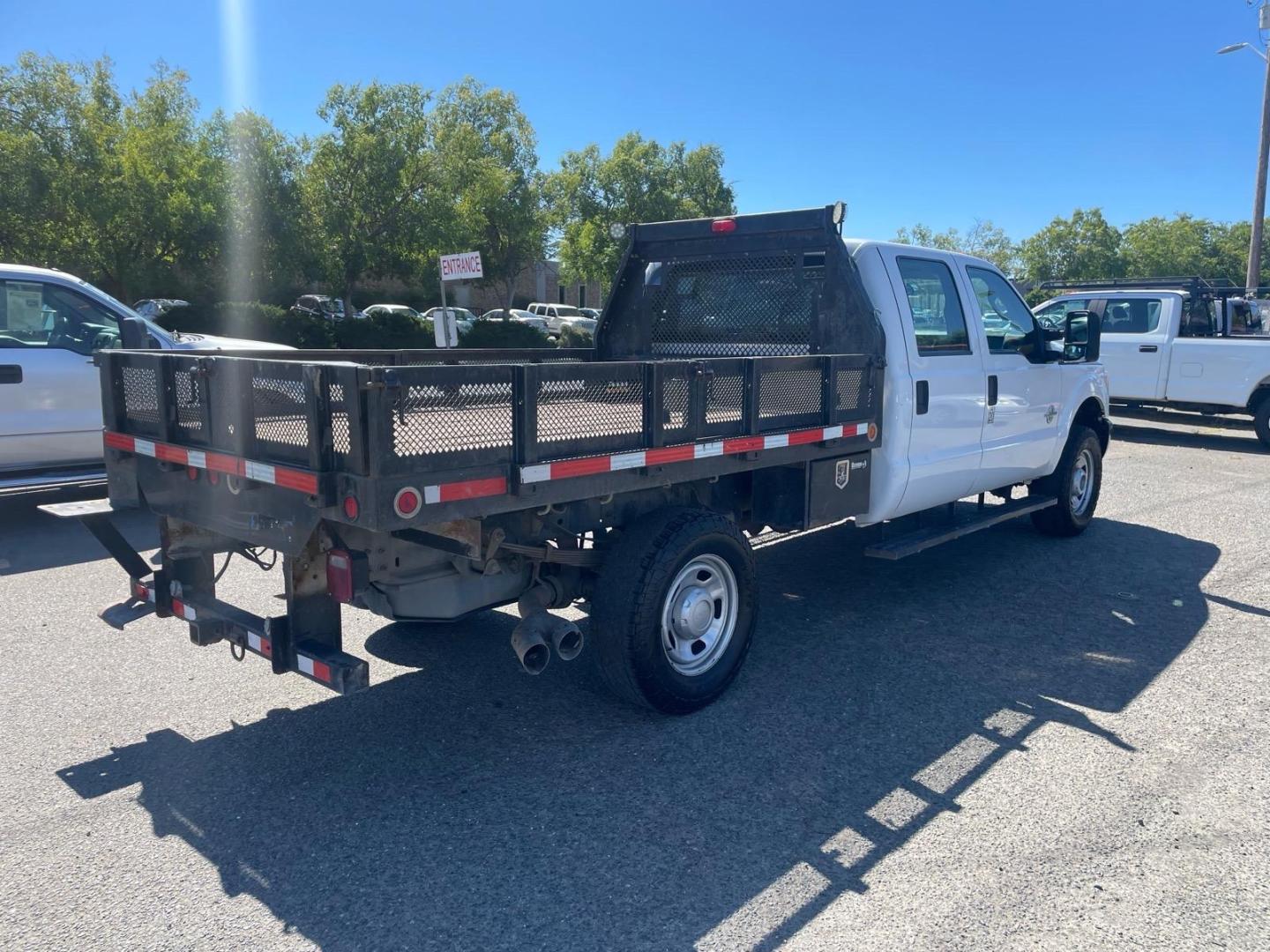 2014 White Ford F-350 Super Duty XL (1FD8W3FTXEE) with an 6.7L Power Stroke 6.7L Biodiesel Turbo V8 300hp 660ft. lbs. Common Rail Direct Injection engine, 6-Speed Shiftable Automatic transmission, located at 800 Riverside Ave, Roseville, CA, 95678, 916-773-4549 & Toll Free: 866-719-4393, 38.732265, -121.291039 - DIESEL CREW CAB 4X4 9 FOOT FLATBED ONE OWNER SERVICE RECORDS ON CLEAN CARFAX- Photo#3