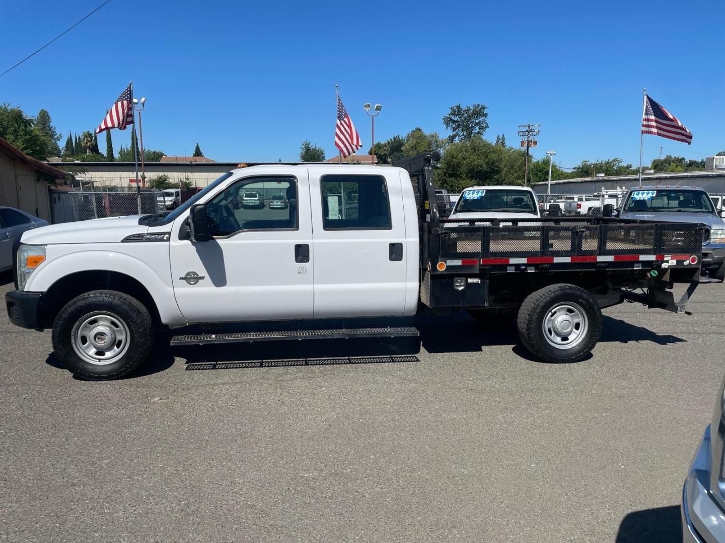 2014 White Ford F-350 Super Duty XL (1FD8W3FTXEE) with an 6.7L Power Stroke 6.7L Biodiesel Turbo V8 300hp 660ft. lbs. Common Rail Direct Injection engine, 6-Speed Shiftable Automatic transmission, located at 800 Riverside Ave, Roseville, CA, 95678, 916-773-4549 & Toll Free: 866-719-4393, 38.732265, -121.291039 - DIESEL CREW CAB 4X4 9 FOOT FLATBED ONE OWNER SERVICE RECORDS ON CLEAN CARFAX- Photo#4