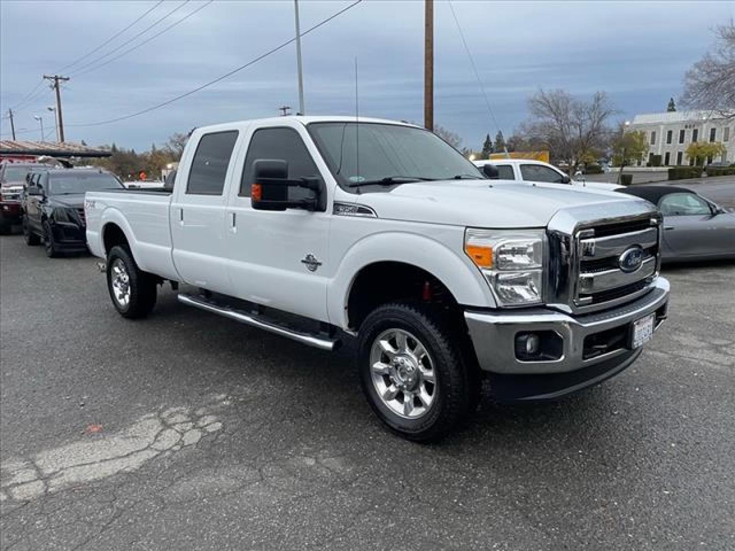 2014 Oxford White Ford F-350 Super Duty Lariat (1FT8W3BT3EE) with an 6.7L Power Stroke 6.7L Biodiesel Turbo V8 400hp 800ft. lbs. Common Rail Direct Injection engine, 6-Speed Shiftable Automatic transmission, located at 800 Riverside Ave, Roseville, CA, 95678, 916-773-4549 & Toll Free: 866-719-4393, 38.732265, -121.291039 - DIESEL CREW CAB 4X4 FX4 LARIAT ONE OWNER OIL SERVICE RECORDS REGULARLY CHANGED ONE OWNER MOON ROOF - Photo#1