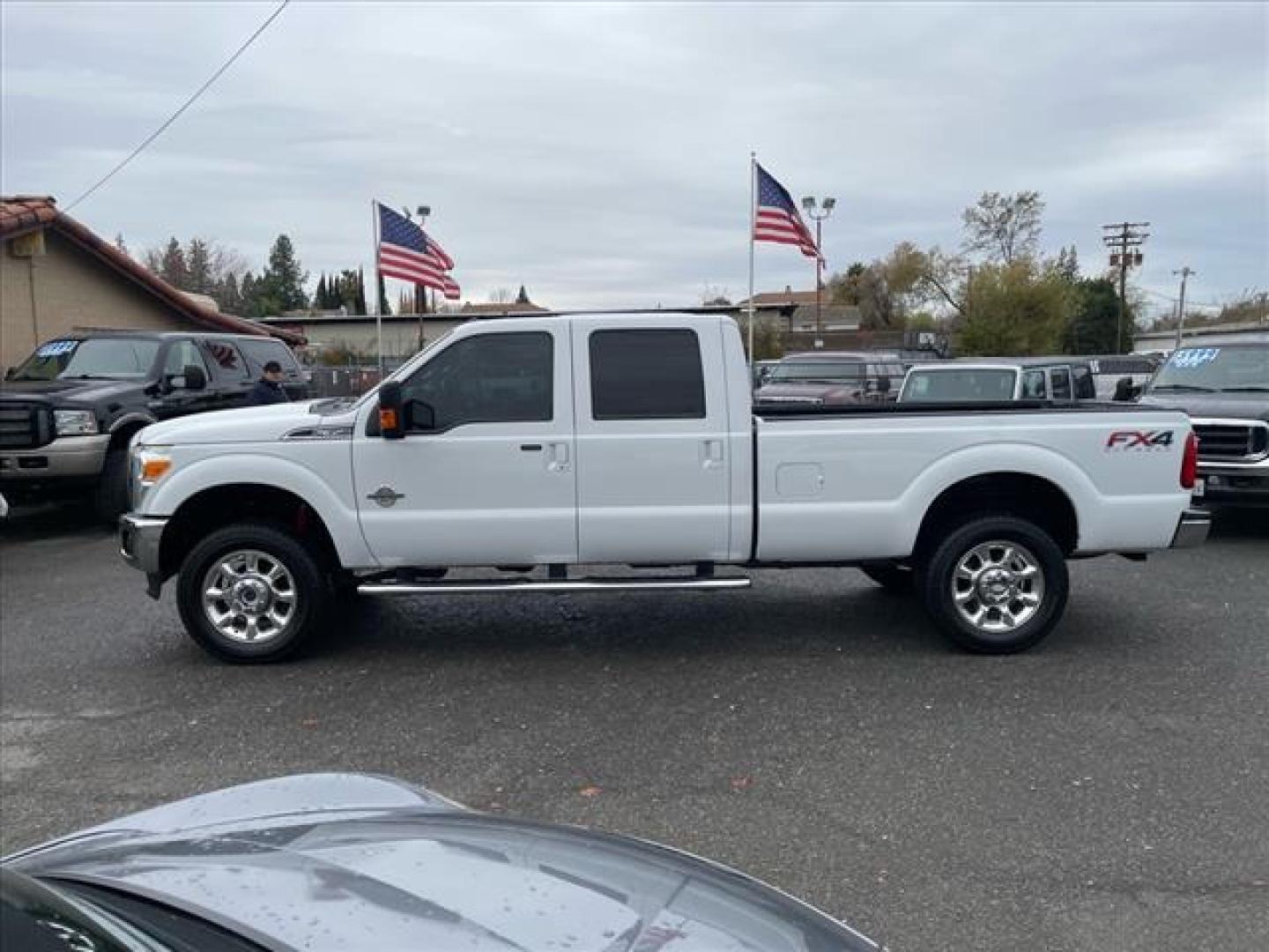 2014 Oxford White Ford F-350 Super Duty Lariat (1FT8W3BT3EE) with an 6.7L Power Stroke 6.7L Biodiesel Turbo V8 400hp 800ft. lbs. Common Rail Direct Injection engine, 6-Speed Shiftable Automatic transmission, located at 800 Riverside Ave, Roseville, CA, 95678, 916-773-4549 & Toll Free: 866-719-4393, 38.732265, -121.291039 - DIESEL CREW CAB 4X4 FX4 LARIAT ONE OWNER OIL SERVICE RECORDS REGULARLY CHANGED ONE OWNER MOON ROOF - Photo#5