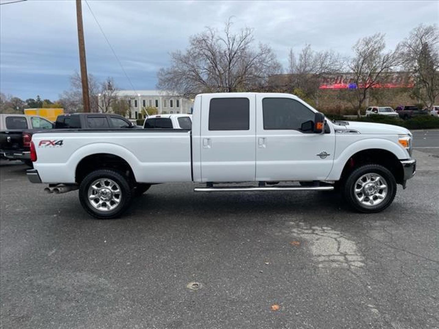 2014 Oxford White Ford F-350 Super Duty Lariat (1FT8W3BT3EE) with an 6.7L Power Stroke 6.7L Biodiesel Turbo V8 400hp 800ft. lbs. Common Rail Direct Injection engine, 6-Speed Shiftable Automatic transmission, located at 800 Riverside Ave, Roseville, CA, 95678, 916-773-4549 & Toll Free: 866-719-4393, 38.732265, -121.291039 - DIESEL CREW CAB 4X4 FX4 LARIAT ONE OWNER OIL SERVICE RECORDS REGULARLY CHANGED ONE OWNER MOON ROOF - Photo#6