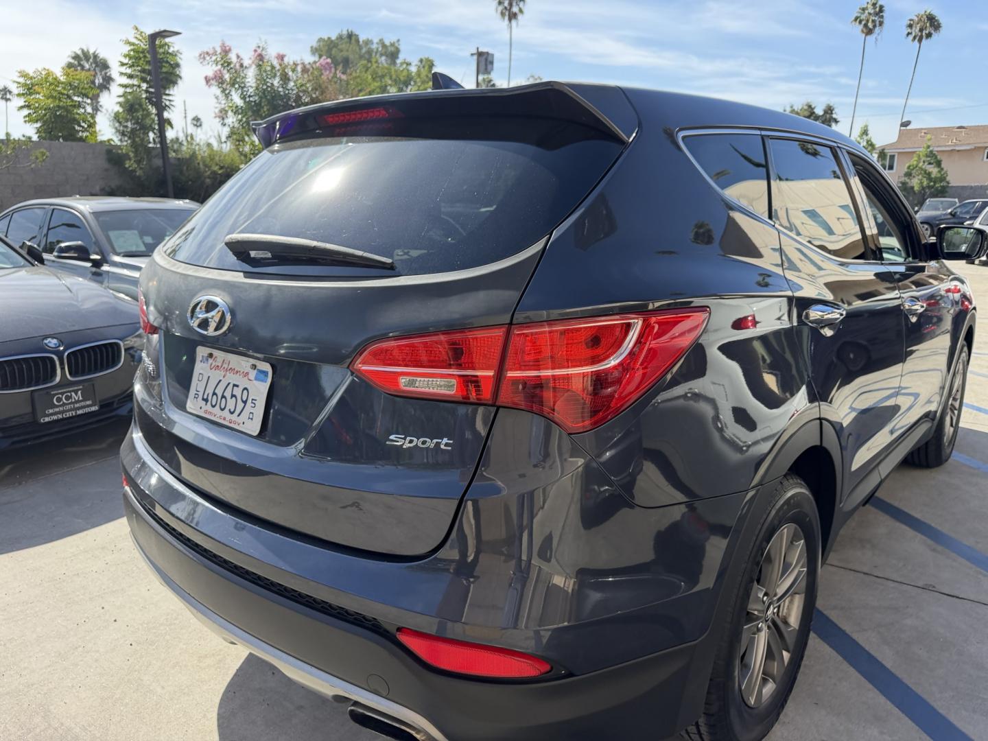 2014 Night Sky Pearl. /Gray Hyundai Santa Fe Sport 2.4 FWD (5XYZT3LB4EG) with an 2.4L L4 DOHC 16V engine, 6-Speed Automatic transmission, located at 30 S. Berkeley Avenue, Pasadena, CA, 91107, (626) 248-7567, 34.145447, -118.109398 - DEALER IDENTIFIER: Crown City Motors Sales | Buy Here Pay Here Pasadena TARGET REGIONS: Pasadena, San Gabriel Valley, Riverside, San Bernardino FINANCING SPECIALTY: Subprime Auto Lending, In-House Financing, Bad Credit Car Loans CA VEHICLE: 2014 Hyundai Santa Fe Sport 2.4L (VIN: 5XYZT3LB4EG131415- Photo#5