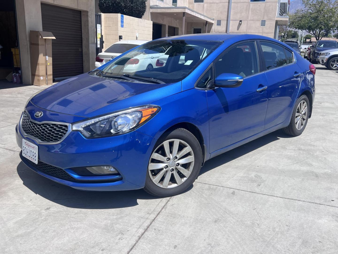 2014 Abyss Blue Pear /Black Kia Forte EX (KNAFX4A82E5) with an 2.0L L4 DOHC 16V engine, 6-Speed Automatic transmission, located at 30 S. Berkeley Avenue, Pasadena, CA, 91107, (626) 248-7567, 34.145447, -118.109398 - ? 2014 Kia Forte EX – Affordable Style and Efficiency with Easy BHPH Financing VIN: KNAFX4A82E5106328 Location: Crown City Motors, Pasadena, CA Financing Options: Buy Here Pay Here | Low Down Payment | Bad Credit OK Looking for a sleek, efficient, and budget-friendly sedan with all the featu - Photo#0