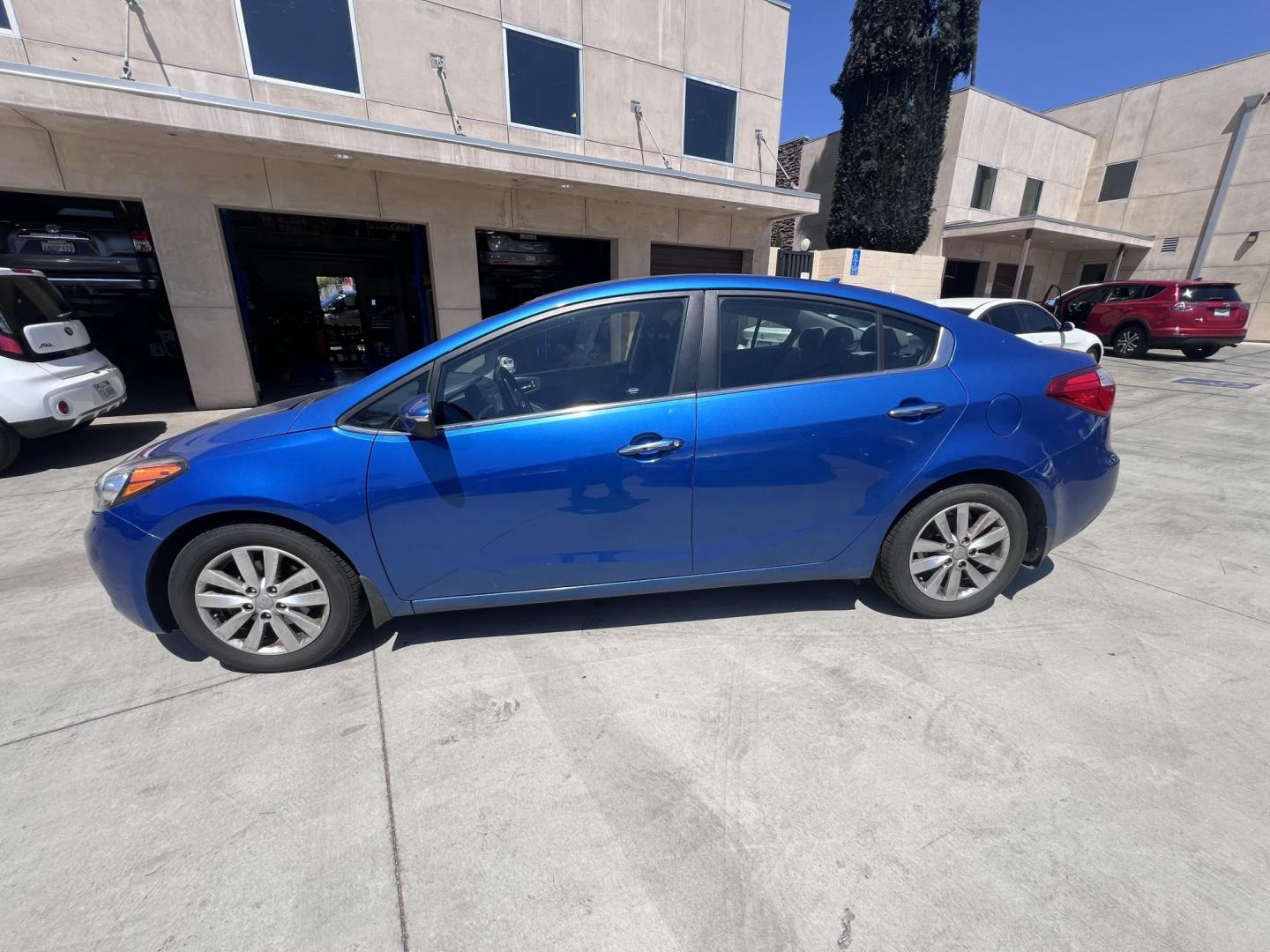 2014 Abyss Blue Pear /Black Kia Forte EX (KNAFX4A82E5) with an 2.0L L4 DOHC 16V engine, 6-Speed Automatic transmission, located at 30 S. Berkeley Avenue, Pasadena, CA, 91107, (626) 248-7567, 34.145447, -118.109398 - ? 2014 Kia Forte EX – Affordable Style and Efficiency with Easy BHPH Financing VIN: KNAFX4A82E5106328 Location: Crown City Motors, Pasadena, CA Financing Options: Buy Here Pay Here | Low Down Payment | Bad Credit OK Looking for a sleek, efficient, and budget-friendly sedan with all the featu - Photo#1