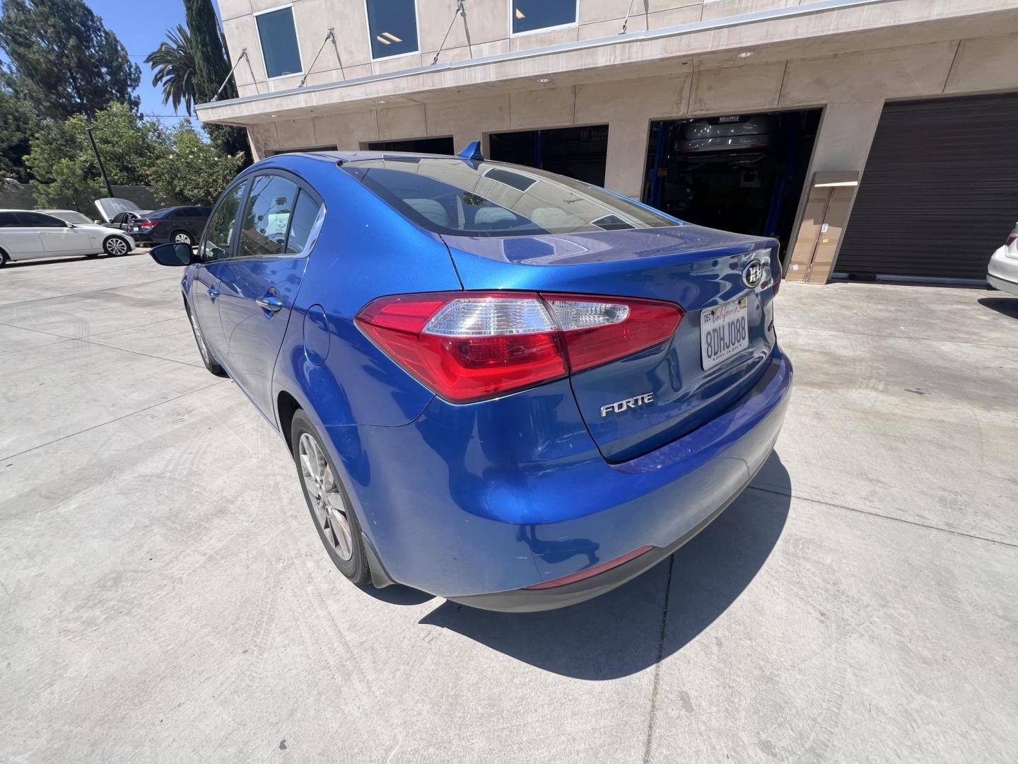 2014 Abyss Blue Pear /Black Kia Forte EX (KNAFX4A82E5) with an 2.0L L4 DOHC 16V engine, 6-Speed Automatic transmission, located at 30 S. Berkeley Avenue, Pasadena, CA, 91107, (626) 248-7567, 34.145447, -118.109398 - ? 2014 Kia Forte EX – Affordable Style and Efficiency with Easy BHPH Financing VIN: KNAFX4A82E5106328 Location: Crown City Motors, Pasadena, CA Financing Options: Buy Here Pay Here | Low Down Payment | Bad Credit OK Looking for a sleek, efficient, and budget-friendly sedan with all the featu - Photo#2