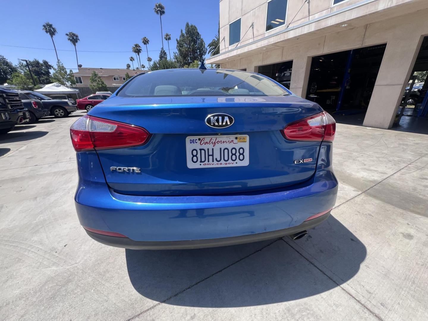 2014 Abyss Blue Pear /Black Kia Forte EX (KNAFX4A82E5) with an 2.0L L4 DOHC 16V engine, 6-Speed Automatic transmission, located at 30 S. Berkeley Avenue, Pasadena, CA, 91107, (626) 248-7567, 34.145447, -118.109398 - ? 2014 Kia Forte EX – Affordable Style and Efficiency with Easy BHPH Financing VIN: KNAFX4A82E5106328 Location: Crown City Motors, Pasadena, CA Financing Options: Buy Here Pay Here | Low Down Payment | Bad Credit OK Looking for a sleek, efficient, and budget-friendly sedan with all the featu - Photo#3