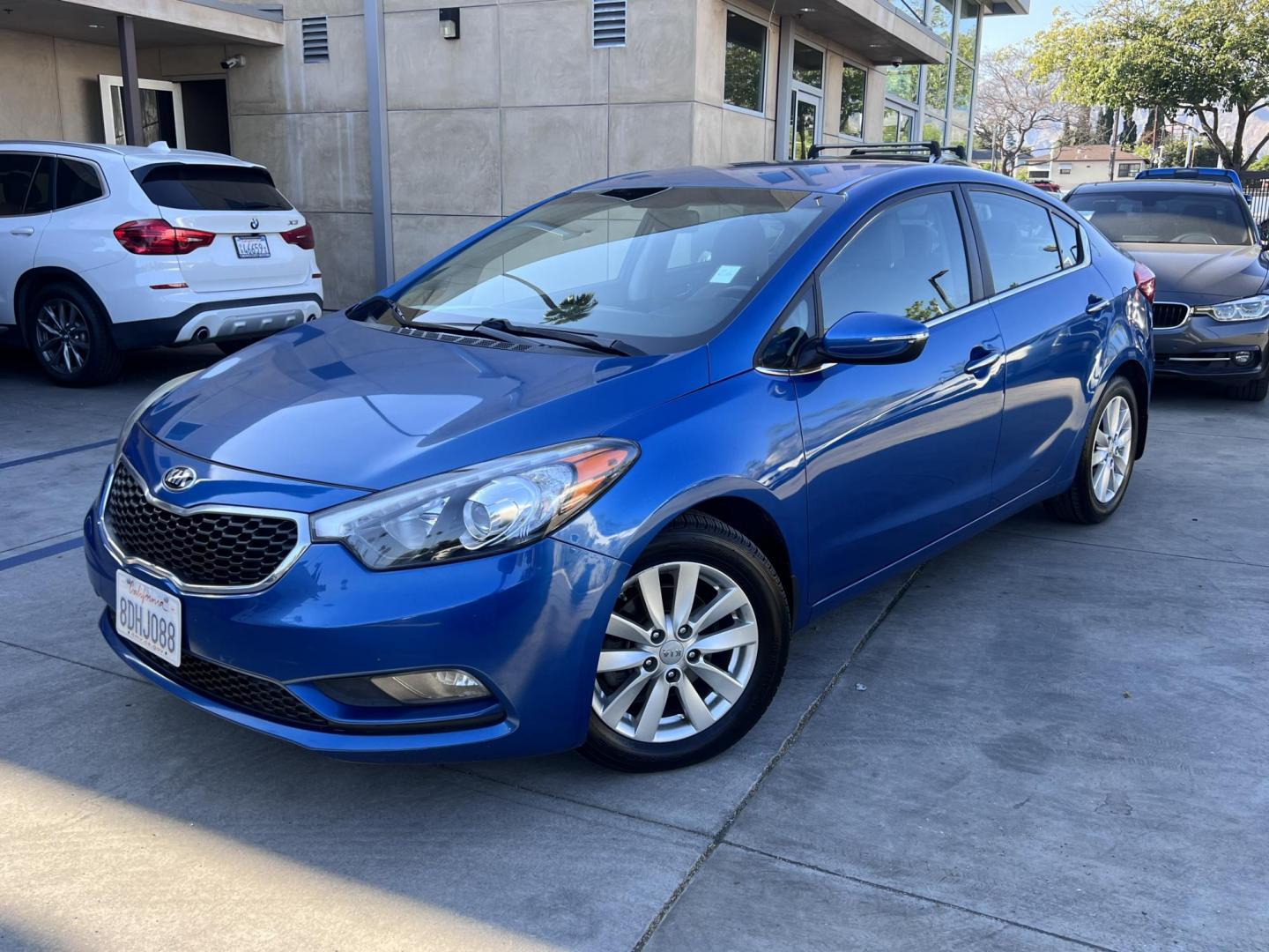 2014 Abyss Blue Pear /Black Kia Forte EX (KNAFX4A82E5) with an 2.0L L4 DOHC 16V engine, 6-Speed Automatic transmission, located at 30 S. Berkeley Avenue, Pasadena, CA, 91107, (626) 248-7567, 34.145447, -118.109398 - ? 2014 Kia Forte EX – Affordable Style and Efficiency with Easy BHPH Financing VIN: KNAFX4A82E5106328 Location: Crown City Motors, Pasadena, CA Financing Options: Buy Here Pay Here | Low Down Payment | Bad Credit OK Looking for a sleek, efficient, and budget-friendly sedan with all the featu - Photo#5