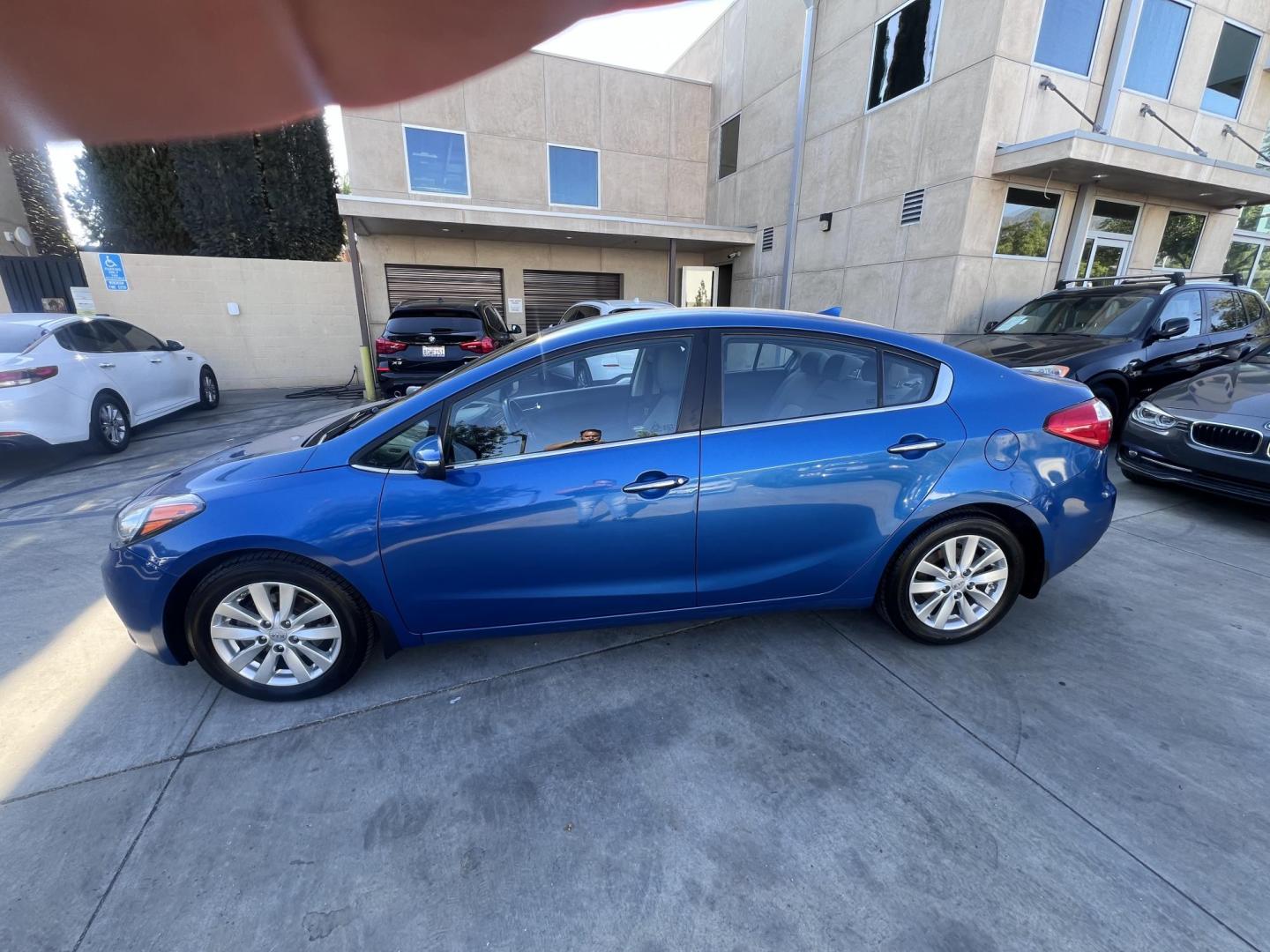 2014 Abyss Blue Pear /Black Kia Forte EX (KNAFX4A82E5) with an 2.0L L4 DOHC 16V engine, 6-Speed Automatic transmission, located at 30 S. Berkeley Avenue, Pasadena, CA, 91107, (626) 248-7567, 34.145447, -118.109398 - ? 2014 Kia Forte EX – Affordable Style and Efficiency with Easy BHPH Financing VIN: KNAFX4A82E5106328 Location: Crown City Motors, Pasadena, CA Financing Options: Buy Here Pay Here | Low Down Payment | Bad Credit OK Looking for a sleek, efficient, and budget-friendly sedan with all the featu - Photo#6