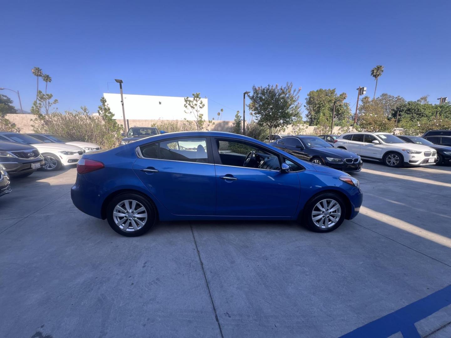 2014 Abyss Blue Pear /Black Kia Forte EX (KNAFX4A82E5) with an 2.0L L4 DOHC 16V engine, 6-Speed Automatic transmission, located at 30 S. Berkeley Avenue, Pasadena, CA, 91107, (626) 248-7567, 34.145447, -118.109398 - ? 2014 Kia Forte EX – Affordable Style and Efficiency with Easy BHPH Financing VIN: KNAFX4A82E5106328 Location: Crown City Motors, Pasadena, CA Financing Options: Buy Here Pay Here | Low Down Payment | Bad Credit OK Looking for a sleek, efficient, and budget-friendly sedan with all the featu - Photo#10