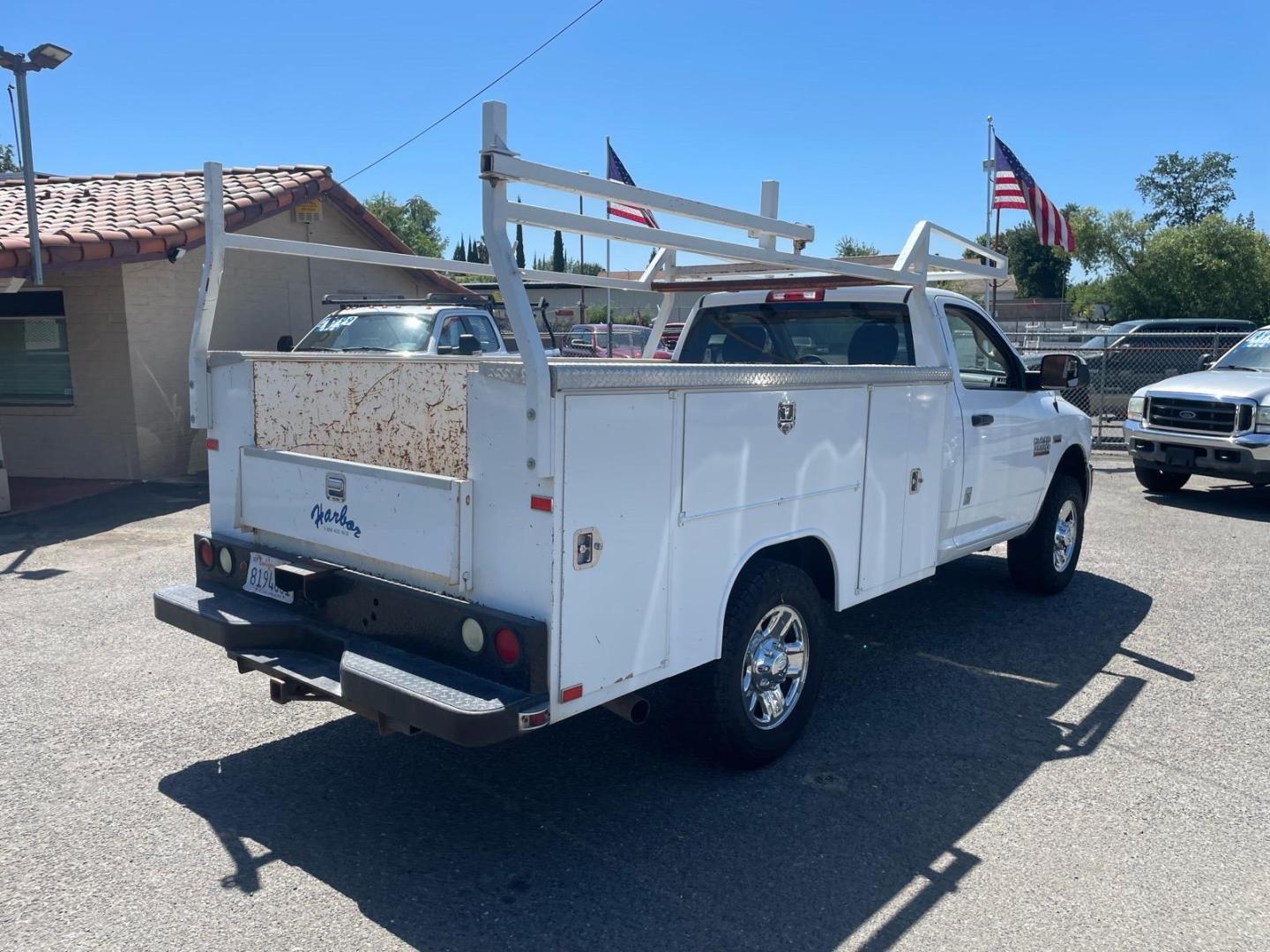 2014 White RAM 3500 Tradesman (3C7WR8AJ2EG) with an HEMI 6.4L V8 370hp 429ft. lbs. Other engine, 6-Speed Shiftable Automatic transmission, located at 800 Riverside Ave, Roseville, CA, 95678, 916-773-4549 & Toll Free: 866-719-4393, 38.732265, -121.291039 - UTILITY BED 72K MILES CLEAN CARFAX- Photo#4