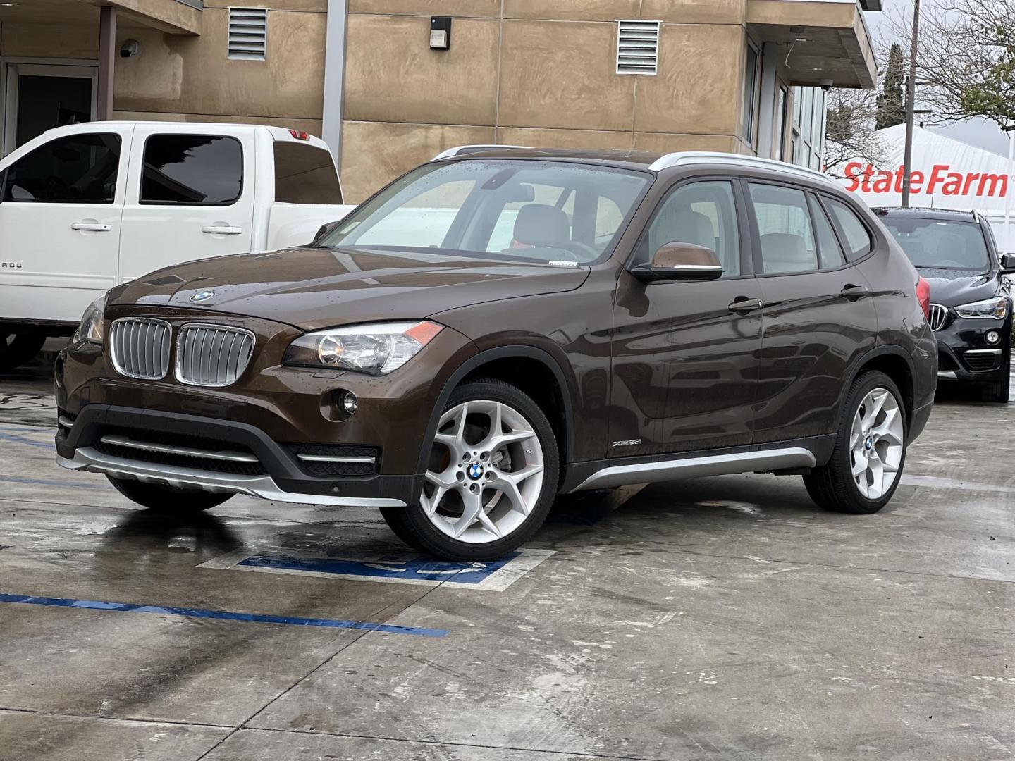 2015 Sparkling Brown Metallic /Tan BMW X1 xDrive28i (WBAVL1C58FV) with an 2.0L L4 DOHC 16V engine, 8-Speed Automatic transmission, located at 30 S. Berkeley Avenue, Pasadena, CA, 91107, (626) 248-7567, 34.145447, -118.109398 - Low Miles! Navigation! Panaramic-roof! Back-up camera! AWD! 2015 BMW X1 for Sale - Low Miles! Navigation! Panoramic Roof! Back-Up Camera! AWD! Discover the Perfect Pre-Owned BMW at Crown City Motors Are you in the market for a luxury SUV that combines performance, elegance, and advanced feat - Photo#0