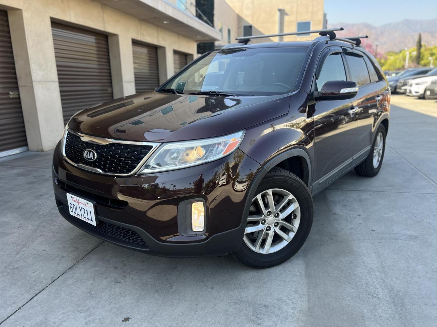 2015 Dark Cherry Pearl /Tan Kia Sorento LX 2WD (5XYKT3A69FG) with an 2.4L L4 DOHC 16V engine, 6-Speed Automatic transmission, located at 30 S. Berkeley Avenue, Pasadena, CA, 91107, (626) 248-7567, 34.145447, -118.109398 - 2015 Kia Sorento – Affordable, Reliable, and Stylish SUV in Pasadena, CA | Buy Here Pay Here Available Looking for a dependable and stylish SUV that won't break the bank? Crown City Motors in Pasadena, CA is proud to offer this 2015 Kia Sorento in a stunning burgundy finish (Dark Cherry Pearl / R - Photo#0