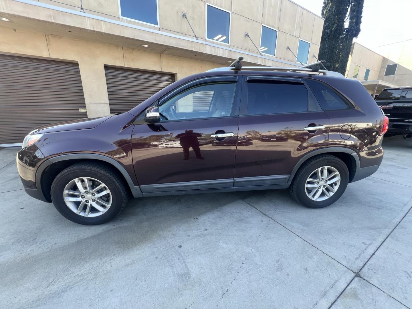 2015 Dark Cherry Pearl /Tan Kia Sorento LX 2WD (5XYKT3A69FG) with an 2.4L L4 DOHC 16V engine, 6-Speed Automatic transmission, located at 30 S. Berkeley Avenue, Pasadena, CA, 91107, (626) 248-7567, 34.145447, -118.109398 - 2015 Kia Sorento – Affordable, Reliable, and Stylish SUV in Pasadena, CA | Buy Here Pay Here Available Looking for a dependable and stylish SUV that won't break the bank? Crown City Motors in Pasadena, CA is proud to offer this 2015 Kia Sorento in a stunning burgundy finish (Dark Cherry Pearl / R - Photo#1