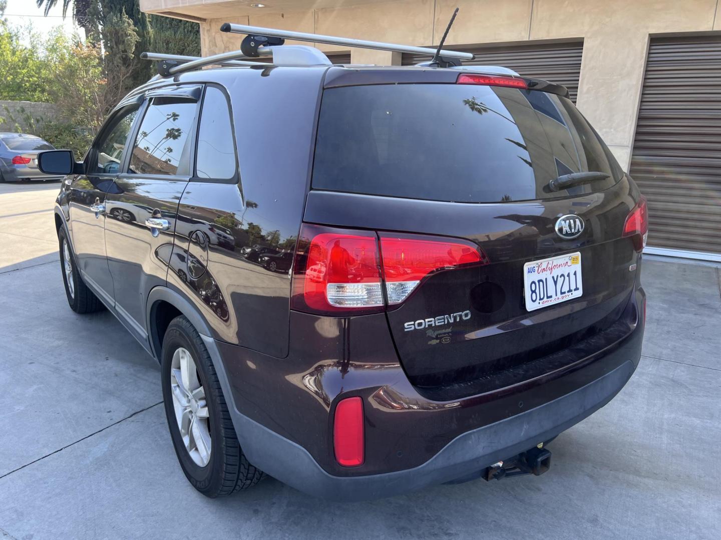 2015 Dark Cherry Pearl /Tan Kia Sorento LX 2WD (5XYKT3A69FG) with an 2.4L L4 DOHC 16V engine, 6-Speed Automatic transmission, located at 30 S. Berkeley Avenue, Pasadena, CA, 91107, (626) 248-7567, 34.145447, -118.109398 - 2015 Kia Sorento – Affordable, Reliable, and Stylish SUV in Pasadena, CA | Buy Here Pay Here Available Looking for a dependable and stylish SUV that won't break the bank? Crown City Motors in Pasadena, CA is proud to offer this 2015 Kia Sorento in a stunning burgundy finish (Dark Cherry Pearl / R - Photo#2