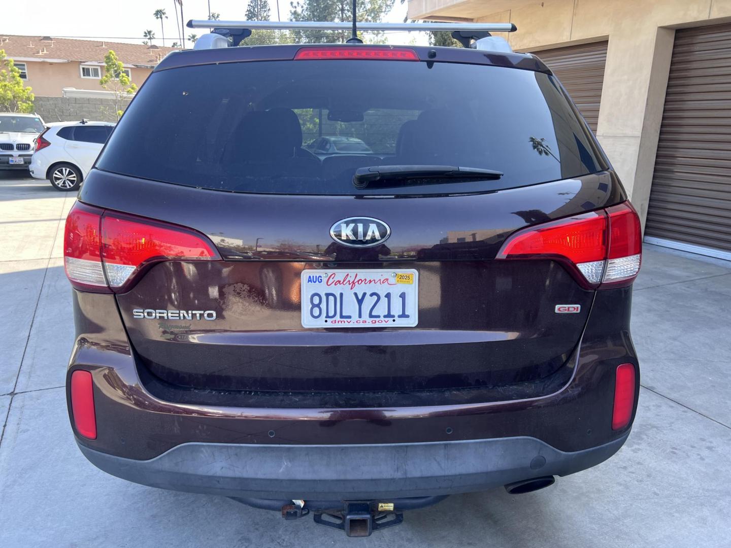 2015 Dark Cherry Pearl /Tan Kia Sorento LX 2WD (5XYKT3A69FG) with an 2.4L L4 DOHC 16V engine, 6-Speed Automatic transmission, located at 30 S. Berkeley Avenue, Pasadena, CA, 91107, (626) 248-7567, 34.145447, -118.109398 - 2015 Kia Sorento – Affordable, Reliable, and Stylish SUV in Pasadena, CA | Buy Here Pay Here Available Looking for a dependable and stylish SUV that won't break the bank? Crown City Motors in Pasadena, CA is proud to offer this 2015 Kia Sorento in a stunning burgundy finish (Dark Cherry Pearl / R - Photo#3