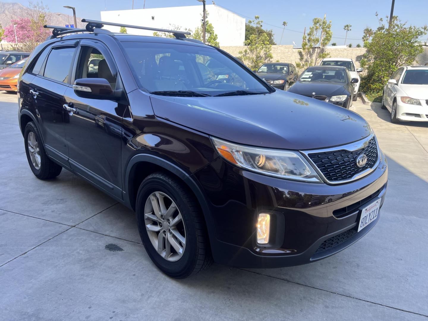 2015 Dark Cherry Pearl /Tan Kia Sorento LX 2WD (5XYKT3A69FG) with an 2.4L L4 DOHC 16V engine, 6-Speed Automatic transmission, located at 30 S. Berkeley Avenue, Pasadena, CA, 91107, (626) 248-7567, 34.145447, -118.109398 - 2015 Kia Sorento – Affordable, Reliable, and Stylish SUV in Pasadena, CA | Buy Here Pay Here Available Looking for a dependable and stylish SUV that won't break the bank? Crown City Motors in Pasadena, CA is proud to offer this 2015 Kia Sorento in a stunning burgundy finish (Dark Cherry Pearl / R - Photo#5