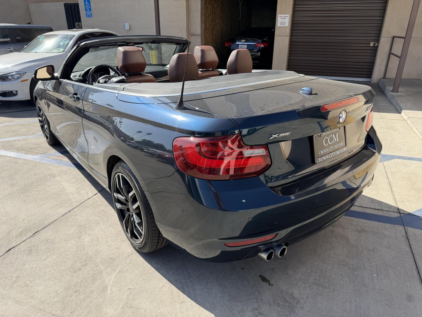 2015 Atlantis Metallic /Black BMW 2-Series 228xi Convertible (WBA1K7C54FV) with an 2.0L L4 DOHC 16V engine, 8A transmission, located at 30 S. Berkeley Avenue, Pasadena, CA, 91107, (626) 248-7567, 34.145447, -118.109398 - 2015 BMW 228i Convertible – Atlantis Metallic | Luxury, Style and Easy Financing in Pasadena Turn heads wherever you go in this stunning 2015 BMW 228i Convertible, finished in rare Atlantis Metallic, a gorgeous blue-green color that shifts beautifully in the sunlight. With its black leather i - Photo#2