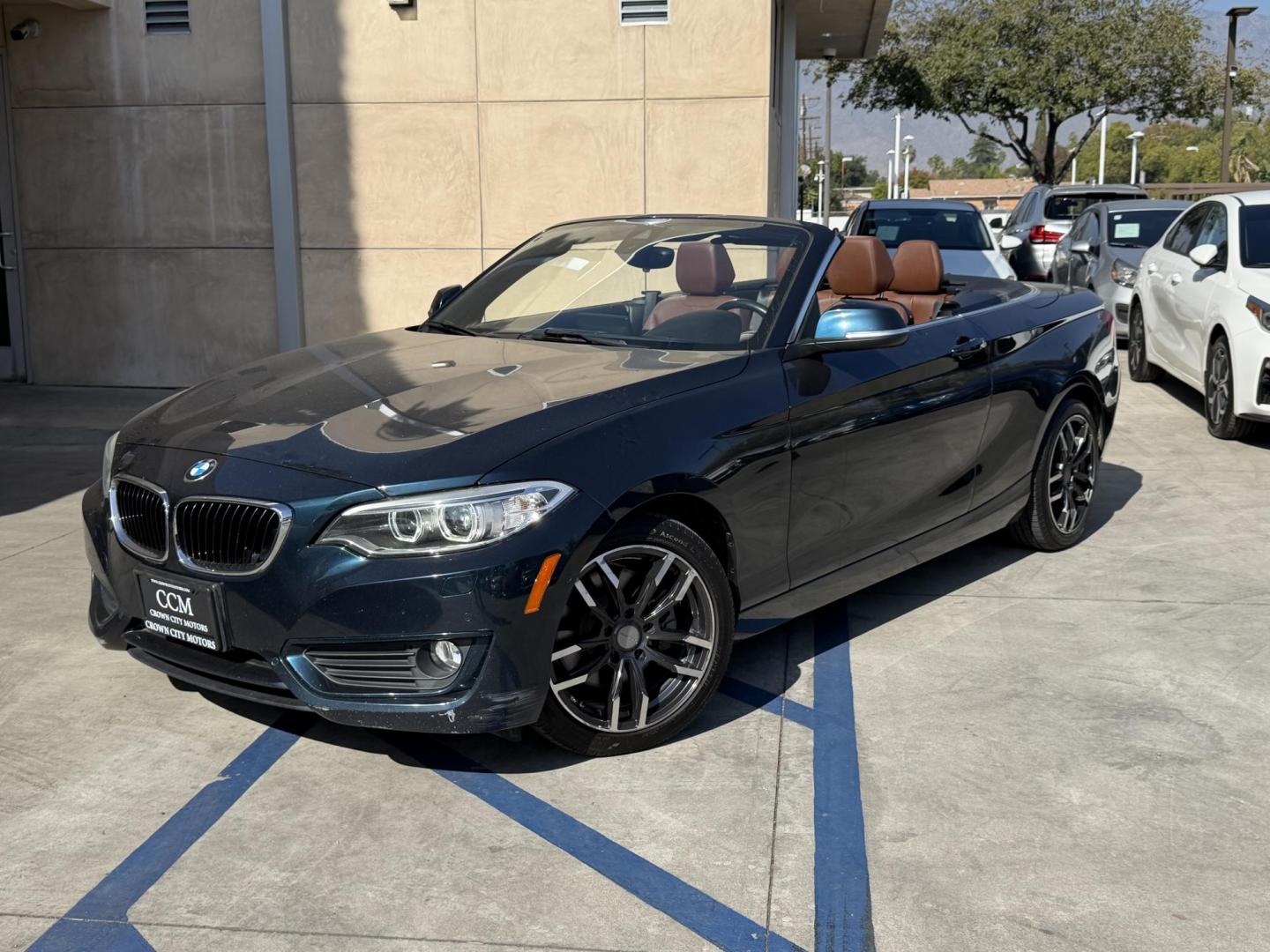 2015 Atlantis Metallic /Black BMW 2-Series 228xi Convertible (WBA1K7C54FV) with an 2.0L L4 DOHC 16V engine, 8A transmission, located at 30 S. Berkeley Avenue, Pasadena, CA, 91107, (626) 248-7567, 34.145447, -118.109398 - 2015 BMW 228i Convertible – Atlantis Metallic | Luxury, Style and Easy Financing in Pasadena Turn heads wherever you go in this stunning 2015 BMW 228i Convertible, finished in rare Atlantis Metallic, a gorgeous blue-green color that shifts beautifully in the sunlight. With its black leather i - Photo#0