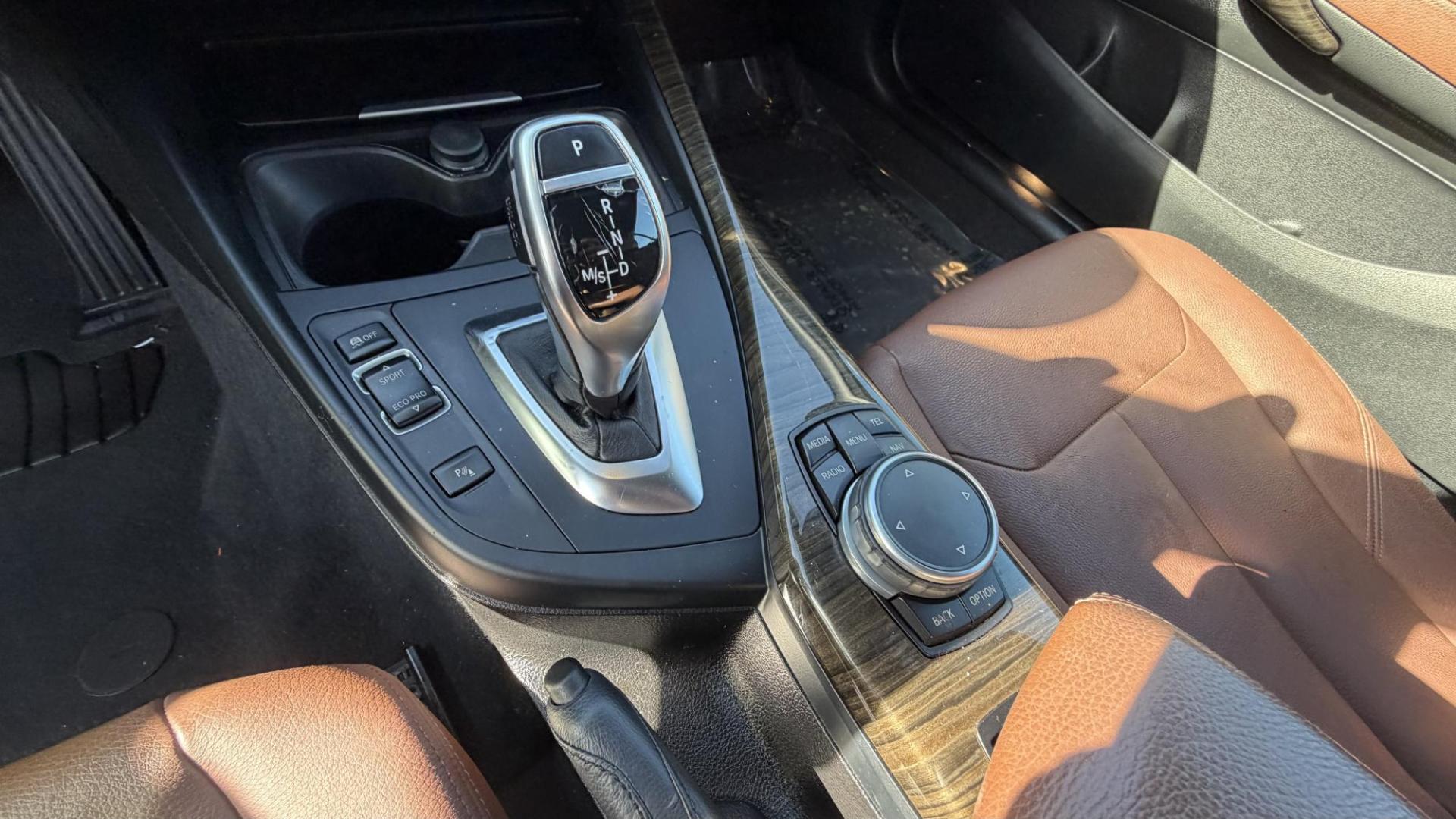 2015 Atlantis Metallic /Black BMW 2-Series 228xi Convertible (WBA1K7C54FV) with an 2.0L L4 DOHC 16V engine, 8A transmission, located at 30 S. Berkeley Avenue, Pasadena, CA, 91107, (626) 248-7567, 34.145447, -118.109398 - 2015 BMW 228i Convertible – Atlantis Metallic | Luxury, Style and Easy Financing in Pasadena Turn heads wherever you go in this stunning 2015 BMW 228i Convertible, finished in rare Atlantis Metallic, a gorgeous blue-green color that shifts beautifully in the sunlight. With its black leather i - Photo#16
