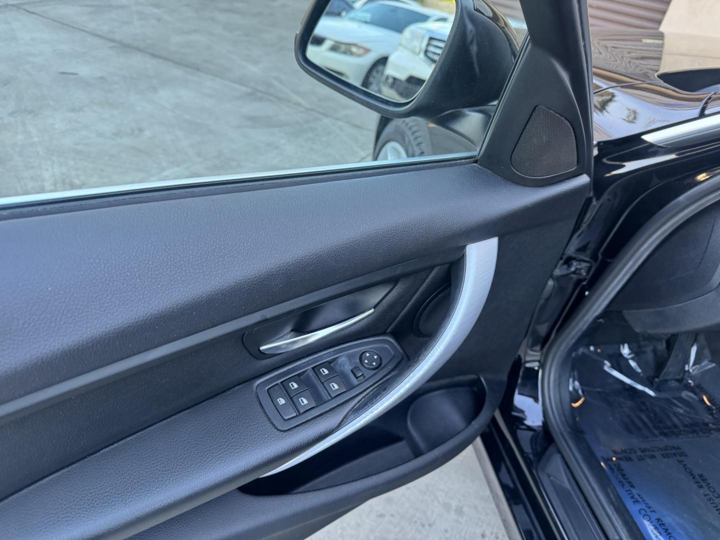 2015 BLACK /Black BMW 3-Series 320i Sedan (WBA3B1C56FK) with an 2.0L L4 DOHC 16V engine, 8-Speed Automatic transmission, located at 30 S. Berkeley Avenue, Pasadena, CA, 91107, (626) 248-7567, 34.145447, -118.109398 - For sale at Crown City Motors, 30 S Berkeley Ave, Pasadena, CA 91107: a sleek and sophisticated 2015 BMW 320i, loaded with premium features for an exceptional driving experience. This compact luxury sedan is equipped with navigation, a moonroof, a backup camera, and the coveted Premium Package, maki - Photo#9