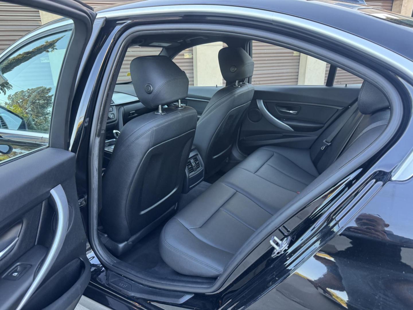 2015 BLACK /Black BMW 3-Series 320i Sedan (WBA3B1C56FK) with an 2.0L L4 DOHC 16V engine, 8-Speed Automatic transmission, located at 30 S. Berkeley Avenue, Pasadena, CA, 91107, (626) 248-7567, 34.145447, -118.109398 - For sale at Crown City Motors, 30 S Berkeley Ave, Pasadena, CA 91107: a sleek and sophisticated 2015 BMW 320i, loaded with premium features for an exceptional driving experience. This compact luxury sedan is equipped with navigation, a moonroof, a backup camera, and the coveted Premium Package, maki - Photo#16