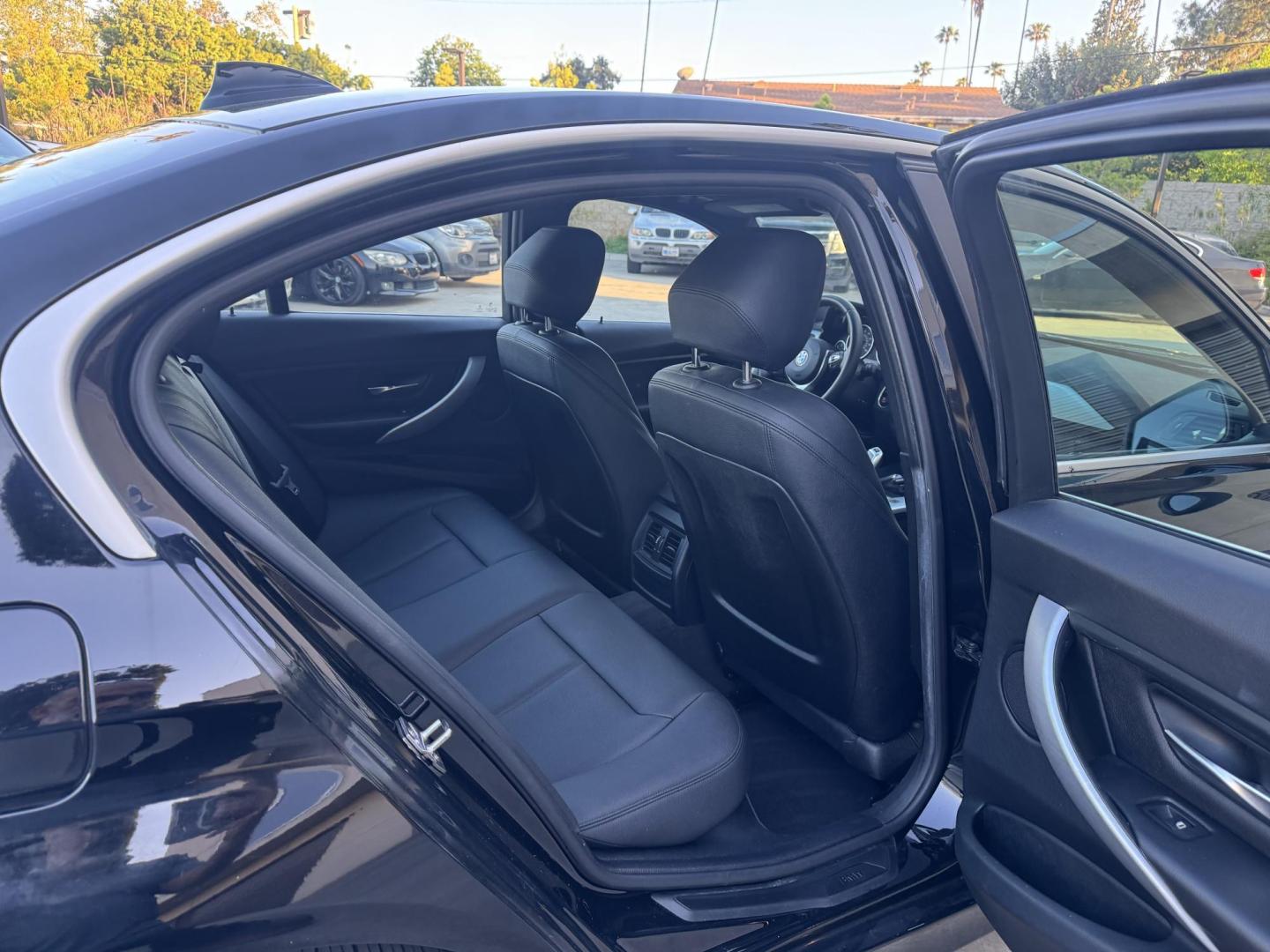 2015 BLACK /Black BMW 3-Series 320i Sedan (WBA3B1C56FK) with an 2.0L L4 DOHC 16V engine, 8-Speed Automatic transmission, located at 30 S. Berkeley Avenue, Pasadena, CA, 91107, (626) 248-7567, 34.145447, -118.109398 - For sale at Crown City Motors, 30 S Berkeley Ave, Pasadena, CA 91107: a sleek and sophisticated 2015 BMW 320i, loaded with premium features for an exceptional driving experience. This compact luxury sedan is equipped with navigation, a moonroof, a backup camera, and the coveted Premium Package, maki - Photo#18