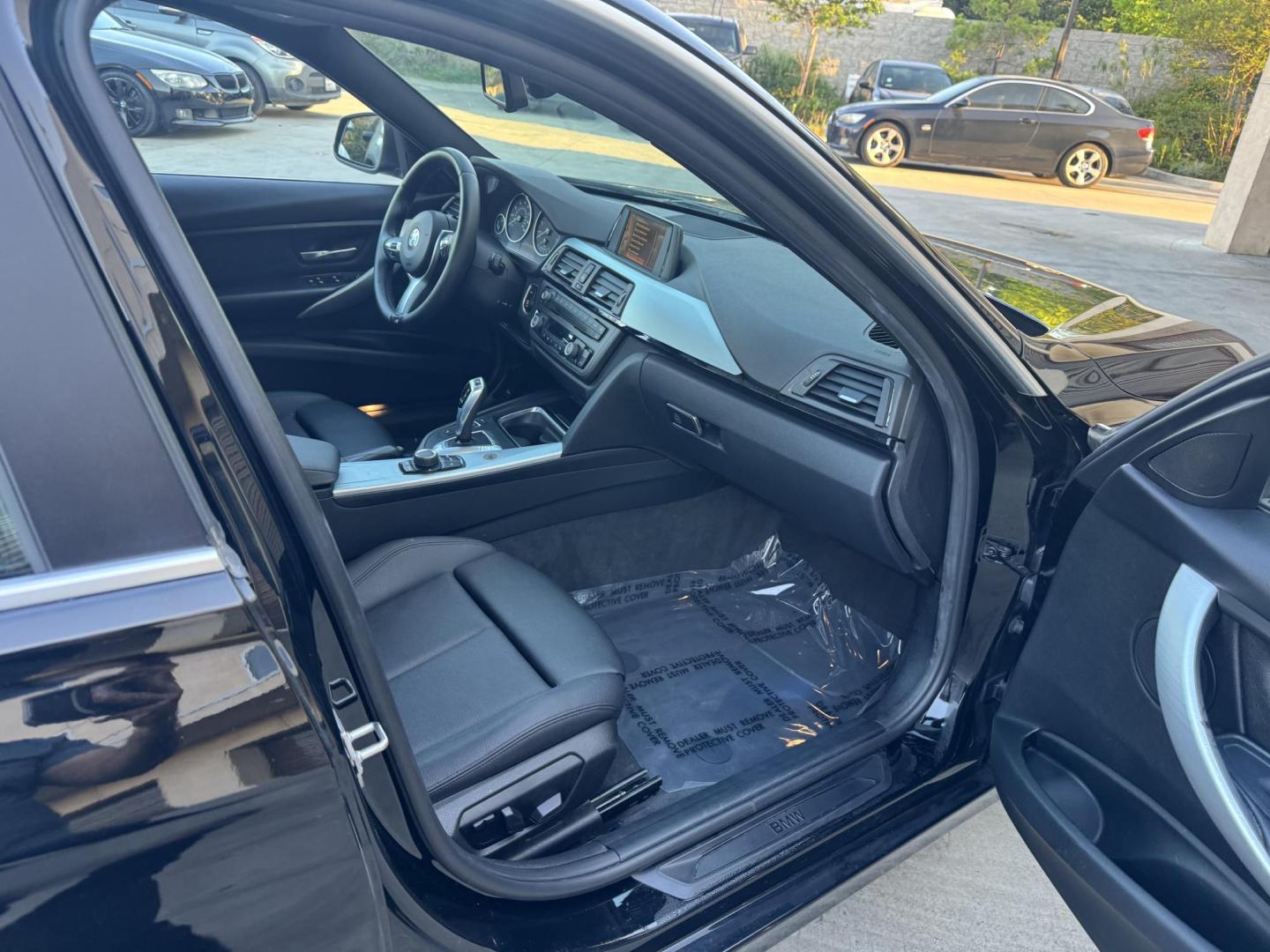 2015 BLACK /Black BMW 3-Series 320i Sedan (WBA3B1C56FK) with an 2.0L L4 DOHC 16V engine, 8-Speed Automatic transmission, located at 30 S. Berkeley Avenue, Pasadena, CA, 91107, (626) 248-7567, 34.145447, -118.109398 - For sale at Crown City Motors, 30 S Berkeley Ave, Pasadena, CA 91107: a sleek and sophisticated 2015 BMW 320i, loaded with premium features for an exceptional driving experience. This compact luxury sedan is equipped with navigation, a moonroof, a backup camera, and the coveted Premium Package, maki - Photo#22