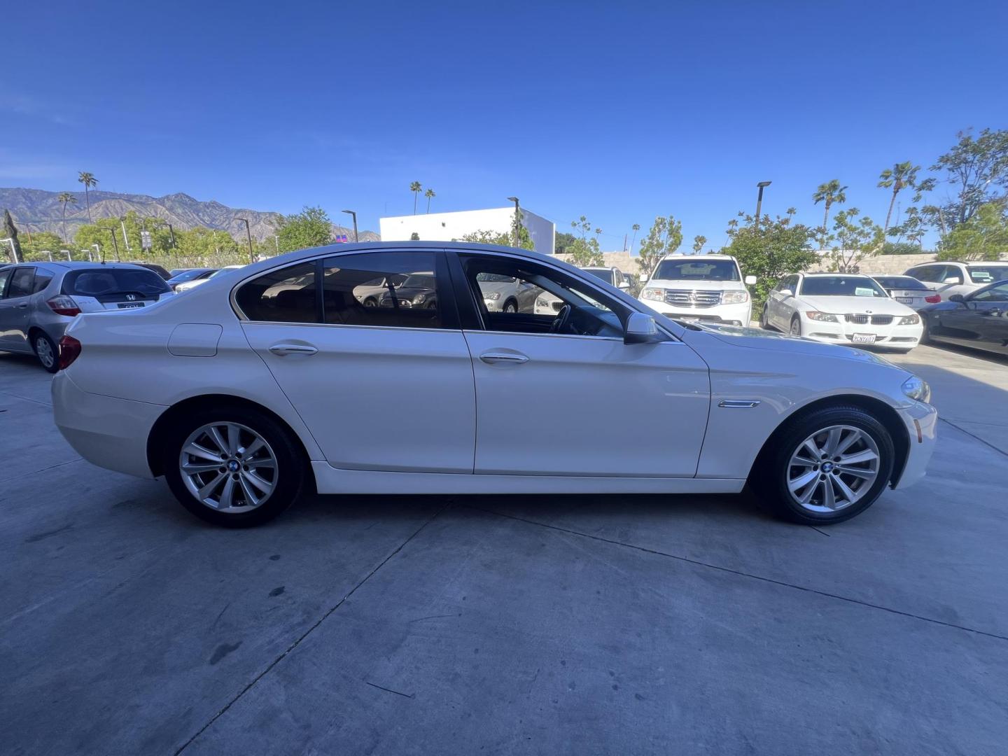 2015 WHITE /Black BMW 5-Series Leather (WBA5A7C54FG) with an 4 Cylinder engine, Automatic transmission, located at 30 S. Berkeley Avenue, Pasadena, CA, 91107, (626) 248-7567, 34.145447, -118.109398 - The 2015 BMW 528i xDrive stands as a beacon of luxury, performance, and advanced technology, embodying the pinnacle of German engineering. With only 72,430 miles, this well-maintained vehicle offers a remarkable driving experience that combines comfort, style, and reliability. Whether you have an im - Photo#4