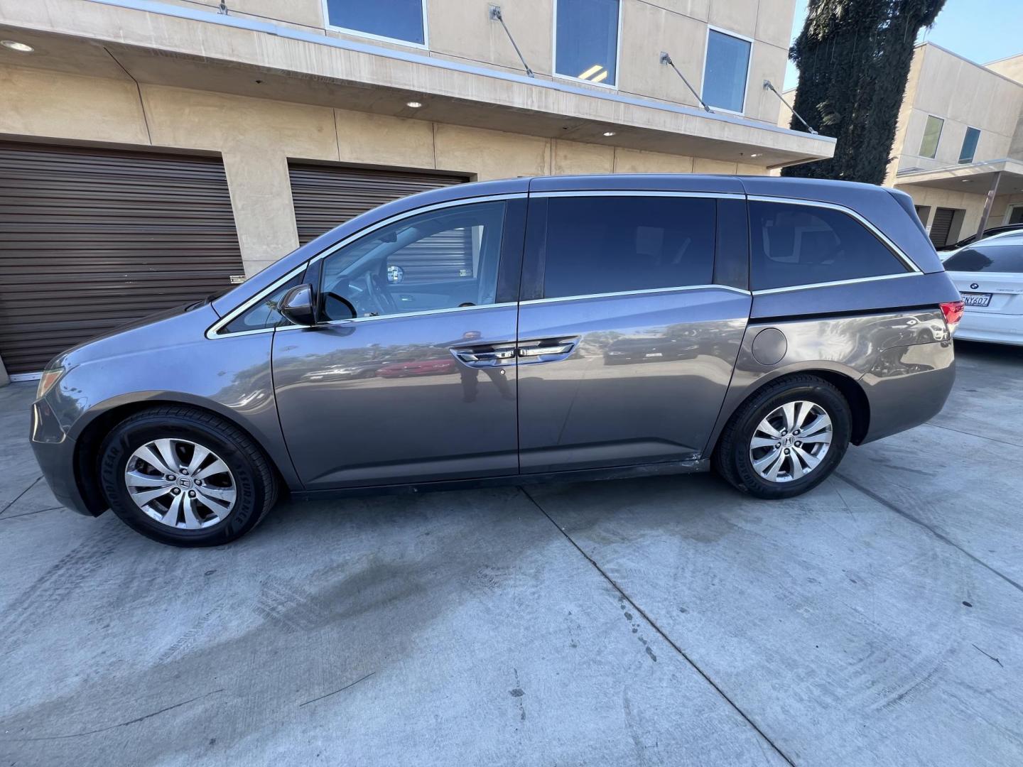 2015 Smoky Topaz Metallic /Gray Honda Odyssey EX-L (5FNRL5H63FB) with an 3.5L V6 SOHC 24V engine, 6-Speed Automatic transmission, located at 30 S. Berkeley Avenue, Pasadena, CA, 91107, (626) 248-7567, 34.145447, -118.109398 - 2015 Honda Odyssey EX-L – Buy Here Pay Here Minivan in Pasadena | $500 Down | No Credit Check | Family-Ready Looking for the perfect family vehicle with room, comfort, and reliability — even if you have bad credit or no credit? Crown City Motors in Pasadena has exactly what you need with this - Photo#2