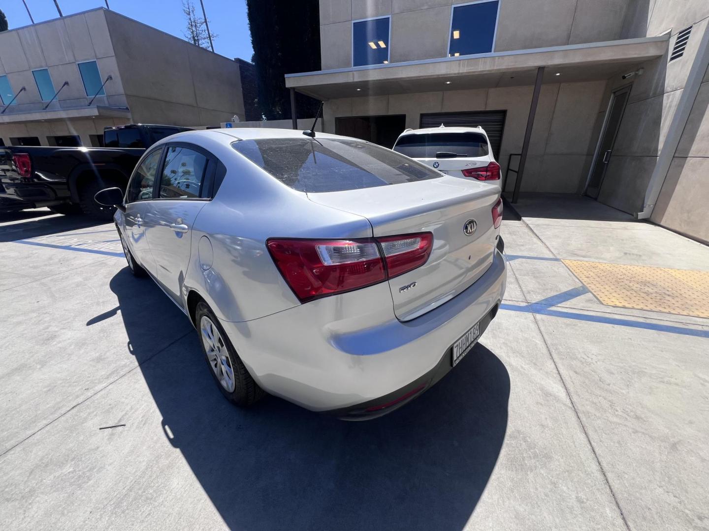 2015 Silver Metallic /Black Kia Rio LX (KNADM4A33F6) with an 1.6L L4 DOHC 16V engine, Maual transmission, located at 30 S. Berkeley Avenue, Pasadena, CA, 91107, (626) 248-7567, 34.145447, -118.109398 - 2015 Kia Rio LX – Fuel-Efficient Compact Sedan – $995 Down – Buy Here Pay Here – Bad Credit OK – Crown City Motors – Pasadena, CA Looking for a clean, fuel-efficient, and affordable sedan that gets you from point A to B with style and reliability? This 2015 Kia Rio LX is the perfect d - Photo#2