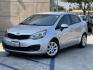 2015 Silver Metallic /Black Kia Rio LX (KNADM4A33F6) with an 1.6L L4 DOHC 16V engine, Maual transmission, located at 30 S. Berkeley Avenue, Pasadena, CA, 91107, (626) 248-7567, 34.145447, -118.109398 - 2015 Kia Rio LX – Fuel-Efficient Compact Sedan – $995 Down – Buy Here Pay Here – Bad Credit OK – Crown City Motors – Pasadena, CA Looking for a clean, fuel-efficient, and affordable sedan that gets you from point A to B with style and reliability? This 2015 Kia Rio LX is the perfect d - Photo#7
