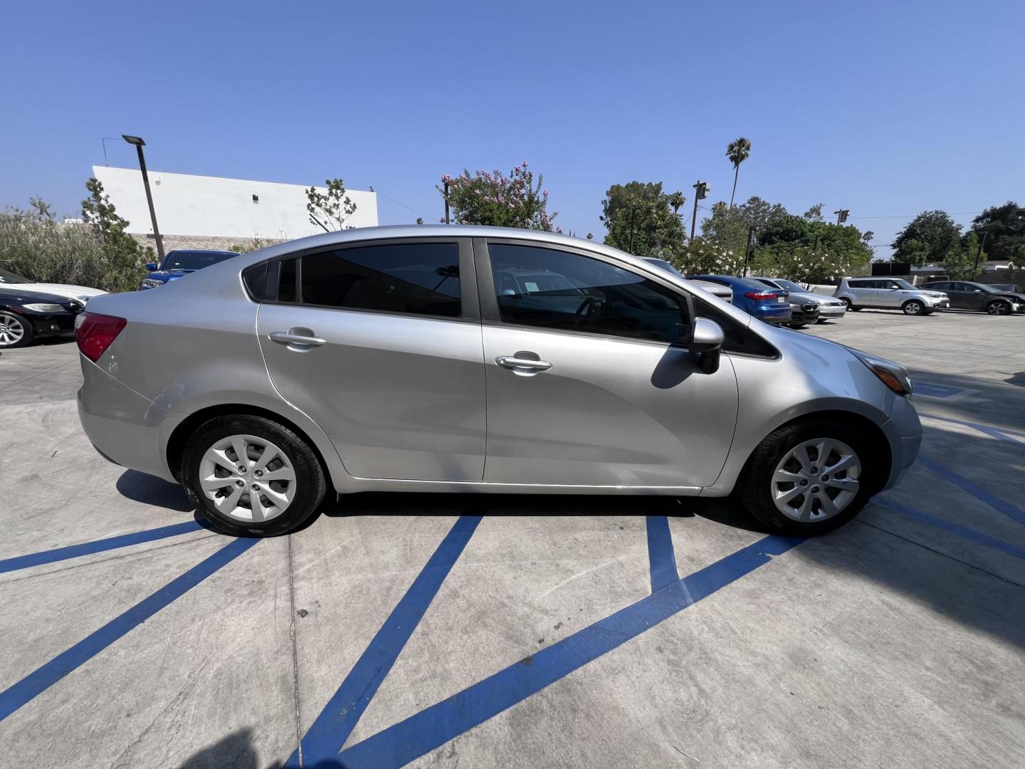 2015 Silver Metallic /Black Kia Rio LX (KNADM4A33F6) with an 1.6L L4 DOHC 16V engine, Maual transmission, located at 30 S. Berkeley Avenue, Pasadena, CA, 91107, (626) 248-7567, 34.145447, -118.109398 - 2015 Kia Rio LX – Fuel-Efficient Compact Sedan – $995 Down – Buy Here Pay Here – Bad Credit OK – Crown City Motors – Pasadena, CA Looking for a clean, fuel-efficient, and affordable sedan that gets you from point A to B with style and reliability? This 2015 Kia Rio LX is the perfect d - Photo#8