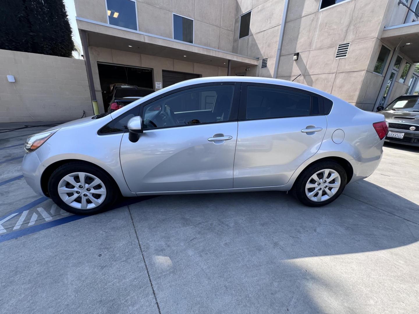 2015 Silver Metallic /Black Kia Rio LX (KNADM4A33F6) with an 1.6L L4 DOHC 16V engine, Maual transmission, located at 30 S. Berkeley Avenue, Pasadena, CA, 91107, (626) 248-7567, 34.145447, -118.109398 - 2015 Kia Rio LX – Fuel-Efficient Compact Sedan – $995 Down – Buy Here Pay Here – Bad Credit OK – Crown City Motors – Pasadena, CA Looking for a clean, fuel-efficient, and affordable sedan that gets you from point A to B with style and reliability? This 2015 Kia Rio LX is the perfect d - Photo#12