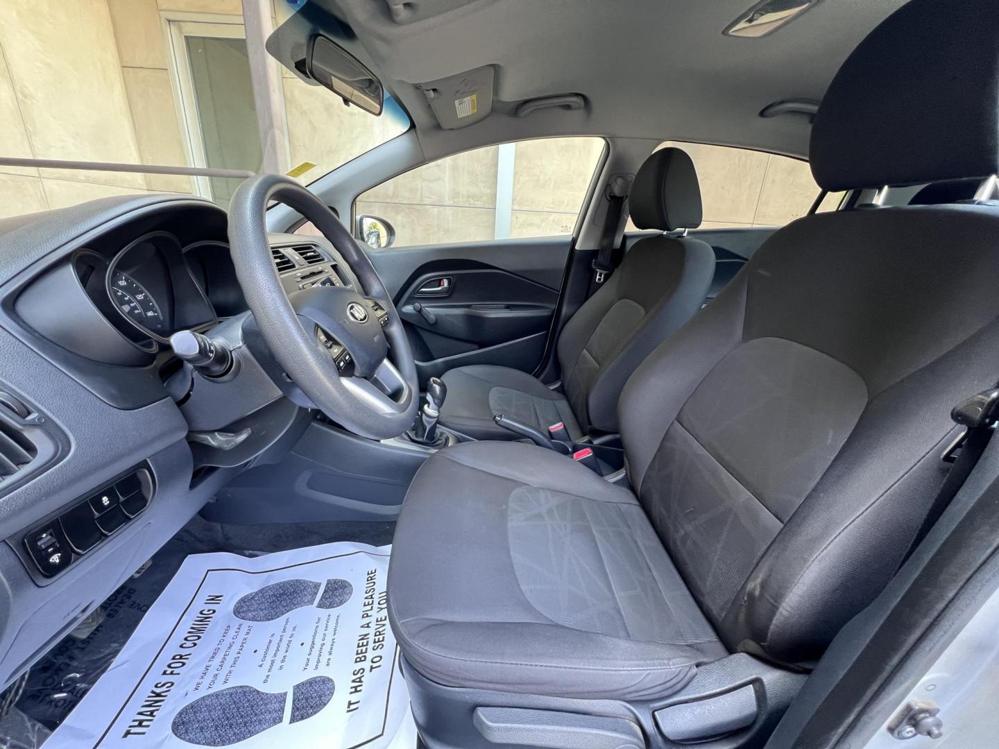 2015 Silver Metallic /Black Kia Rio LX (KNADM4A33F6) with an 1.6L L4 DOHC 16V engine, Maual transmission, located at 30 S. Berkeley Avenue, Pasadena, CA, 91107, (626) 248-7567, 34.145447, -118.109398 - 2015 Kia Rio LX – Fuel-Efficient Compact Sedan – $995 Down – Buy Here Pay Here – Bad Credit OK – Crown City Motors – Pasadena, CA Looking for a clean, fuel-efficient, and affordable sedan that gets you from point A to B with style and reliability? This 2015 Kia Rio LX is the perfect d - Photo#16