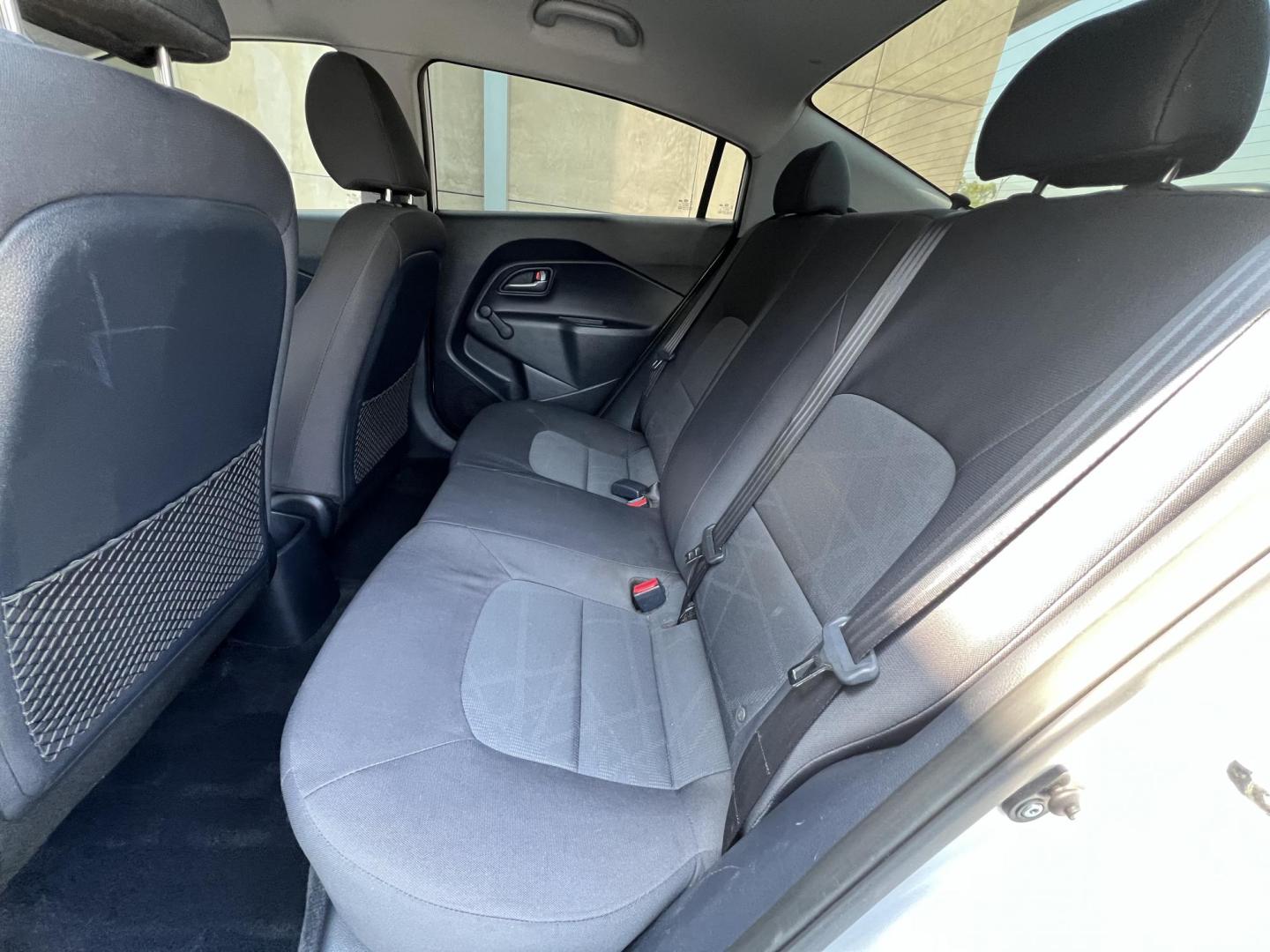 2015 Silver Metallic /Black Kia Rio LX (KNADM4A33F6) with an 1.6L L4 DOHC 16V engine, Maual transmission, located at 30 S. Berkeley Avenue, Pasadena, CA, 91107, (626) 248-7567, 34.145447, -118.109398 - 2015 Kia Rio LX – Fuel-Efficient Compact Sedan – $995 Down – Buy Here Pay Here – Bad Credit OK – Crown City Motors – Pasadena, CA Looking for a clean, fuel-efficient, and affordable sedan that gets you from point A to B with style and reliability? This 2015 Kia Rio LX is the perfect d - Photo#23