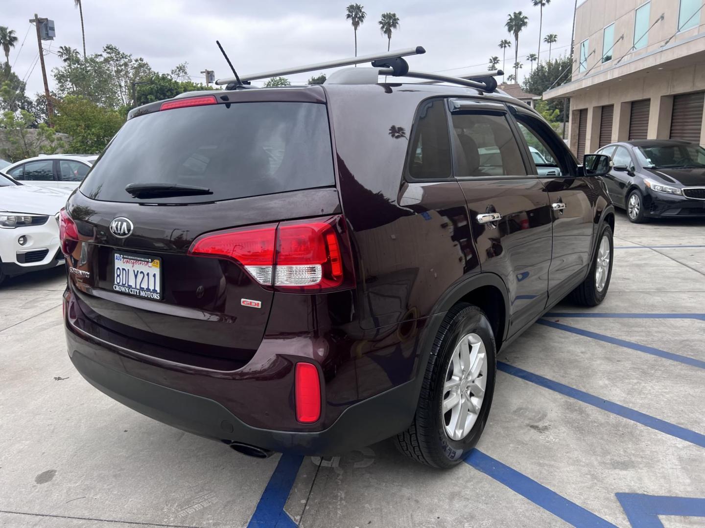 2015 Dark Cherry Pearl /Tan Kia Sorento LX 2WD (5XYKT3A69FG) with an 2.4L L4 DOHC 16V engine, 6-Speed Automatic transmission, located at 30 S. Berkeley Avenue, Pasadena, CA, 91107, (626) 248-7567, 34.145447, -118.109398 - 2015 Kia Sorento – Affordable, Reliable, and Stylish SUV in Pasadena, CA | Buy Here Pay Here Available Looking for a dependable and stylish SUV that won't break the bank? Crown City Motors in Pasadena, CA is proud to offer this 2015 Kia Sorento in a stunning burgundy finish (Dark Cherry Pearl / R - Photo#12