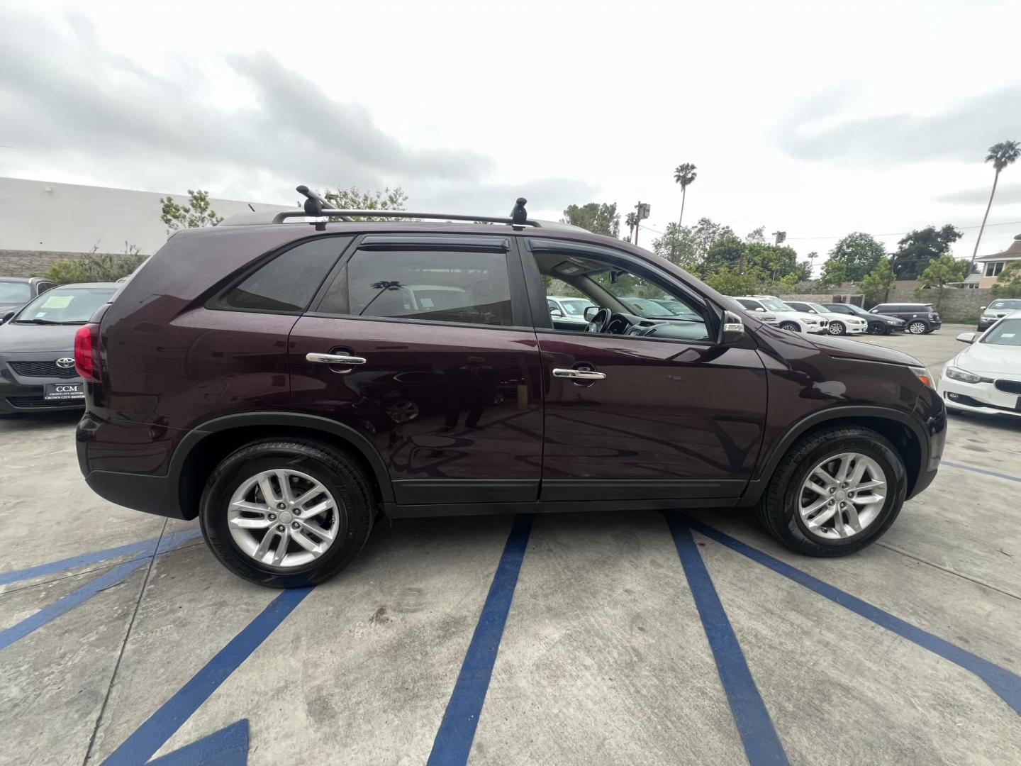 2015 Dark Cherry Pearl /Tan Kia Sorento LX 2WD (5XYKT3A69FG) with an 2.4L L4 DOHC 16V engine, 6-Speed Automatic transmission, located at 30 S. Berkeley Avenue, Pasadena, CA, 91107, (626) 248-7567, 34.145447, -118.109398 - 2015 Kia Sorento – Affordable, Reliable, and Stylish SUV in Pasadena, CA | Buy Here Pay Here Available Looking for a dependable and stylish SUV that won't break the bank? Crown City Motors in Pasadena, CA is proud to offer this 2015 Kia Sorento in a stunning burgundy finish (Dark Cherry Pearl / R - Photo#13