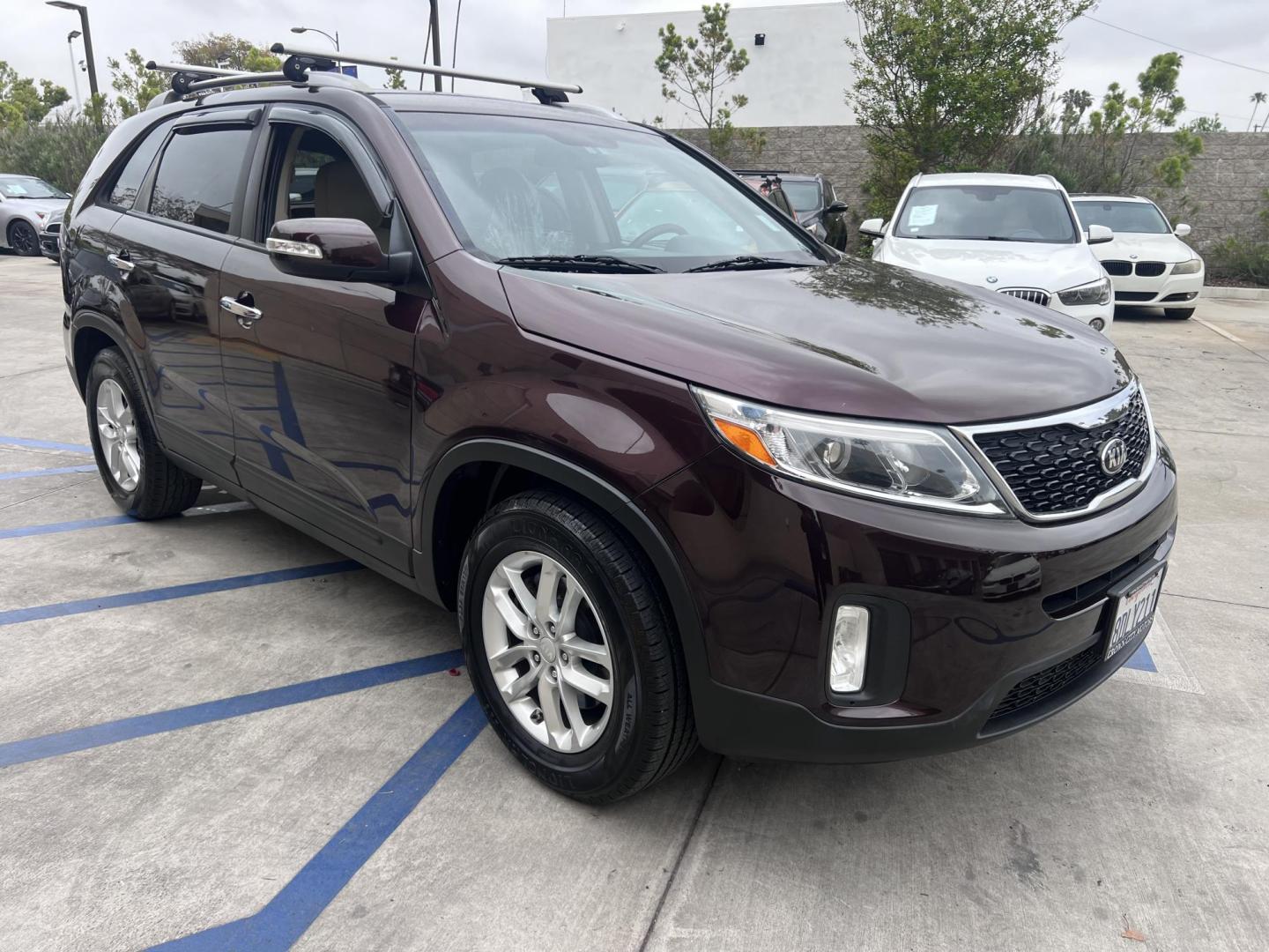 2015 Dark Cherry Pearl /Tan Kia Sorento LX 2WD (5XYKT3A69FG) with an 2.4L L4 DOHC 16V engine, 6-Speed Automatic transmission, located at 30 S. Berkeley Avenue, Pasadena, CA, 91107, (626) 248-7567, 34.145447, -118.109398 - 2015 Kia Sorento – Affordable, Reliable, and Stylish SUV in Pasadena, CA | Buy Here Pay Here Available Looking for a dependable and stylish SUV that won't break the bank? Crown City Motors in Pasadena, CA is proud to offer this 2015 Kia Sorento in a stunning burgundy finish (Dark Cherry Pearl / R - Photo#14