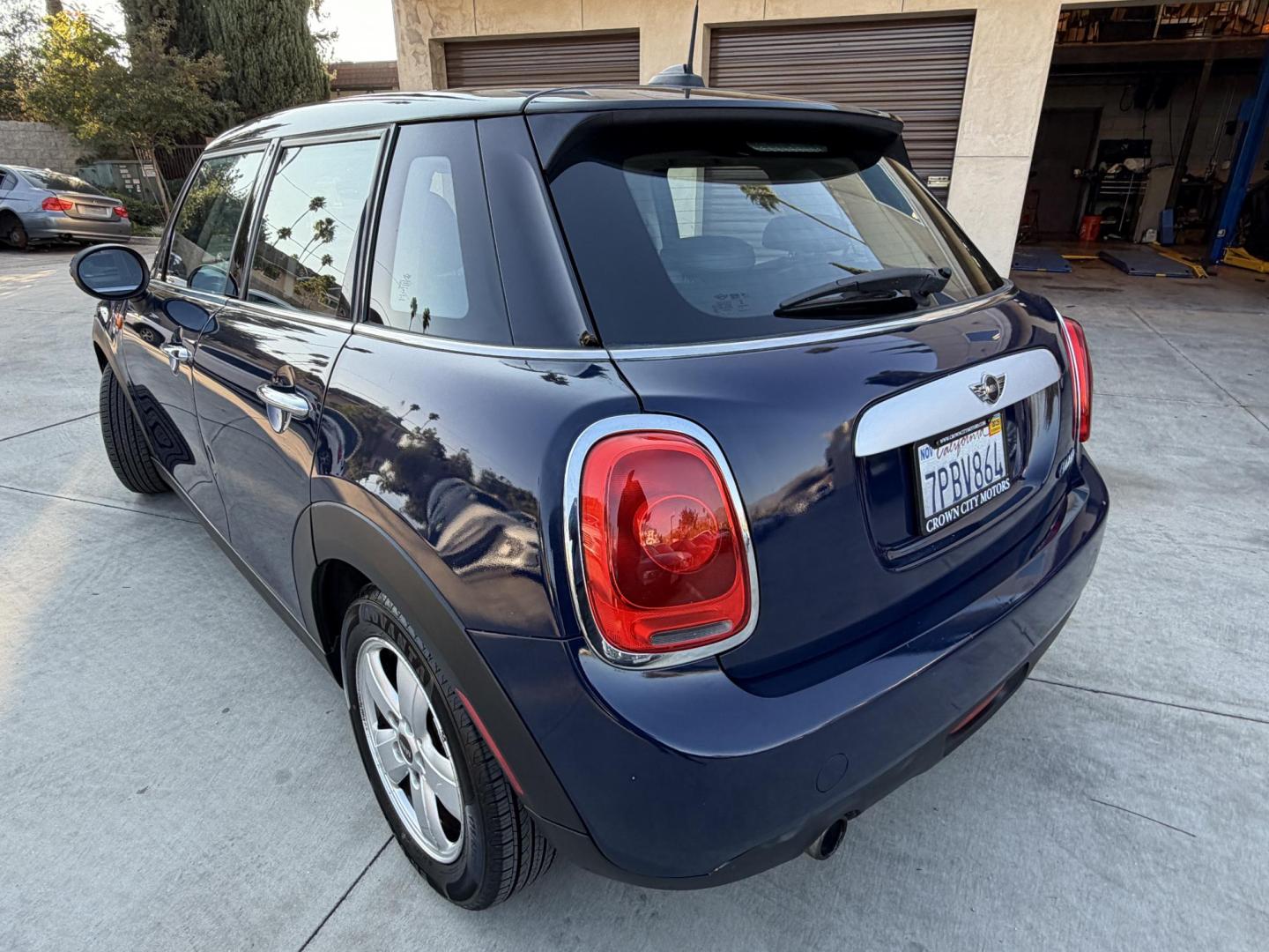 2015 Deep Blue Metallic /Black Mini Cooper Base (WMWXS5C50FT) with an 1.5L L3 engine, Automatic transmission, located at 30 S. Berkeley Avenue, Pasadena, CA, 91107, (626) 248-7567, 34.145447, -118.109398 - 2015 MINI Cooper Hardtop – Deep Blue Metallic | Style, Efficiency and Easy Financing in Pasadena Drive away in this stylish and fun-to-drive 2015 MINI Cooper Hardtop, finished in stunning Deep Blue Metallic with a black interior. Compact, sporty, and full of character, this MINI delivers worl- Photo#2