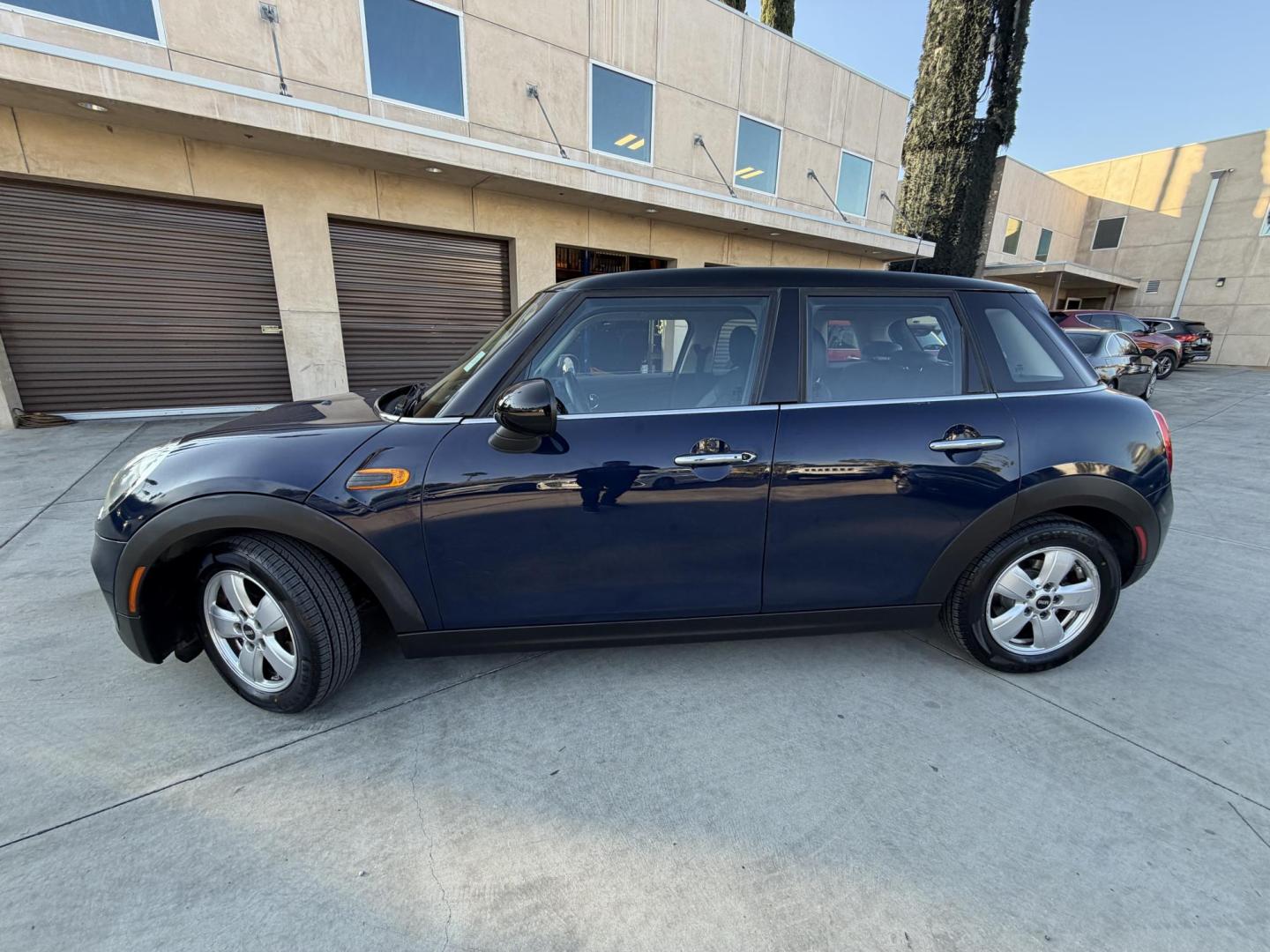 2015 Deep Blue Metallic /Black Mini Cooper Base (WMWXS5C50FT) with an 1.5L L3 engine, Automatic transmission, located at 30 S. Berkeley Avenue, Pasadena, CA, 91107, (626) 248-7567, 34.145447, -118.109398 - 2015 MINI Cooper Hardtop – Deep Blue Metallic | Style, Efficiency and Easy Financing in Pasadena Drive away in this stylish and fun-to-drive 2015 MINI Cooper Hardtop, finished in stunning Deep Blue Metallic with a black interior. Compact, sporty, and full of character, this MINI delivers worl- Photo#1