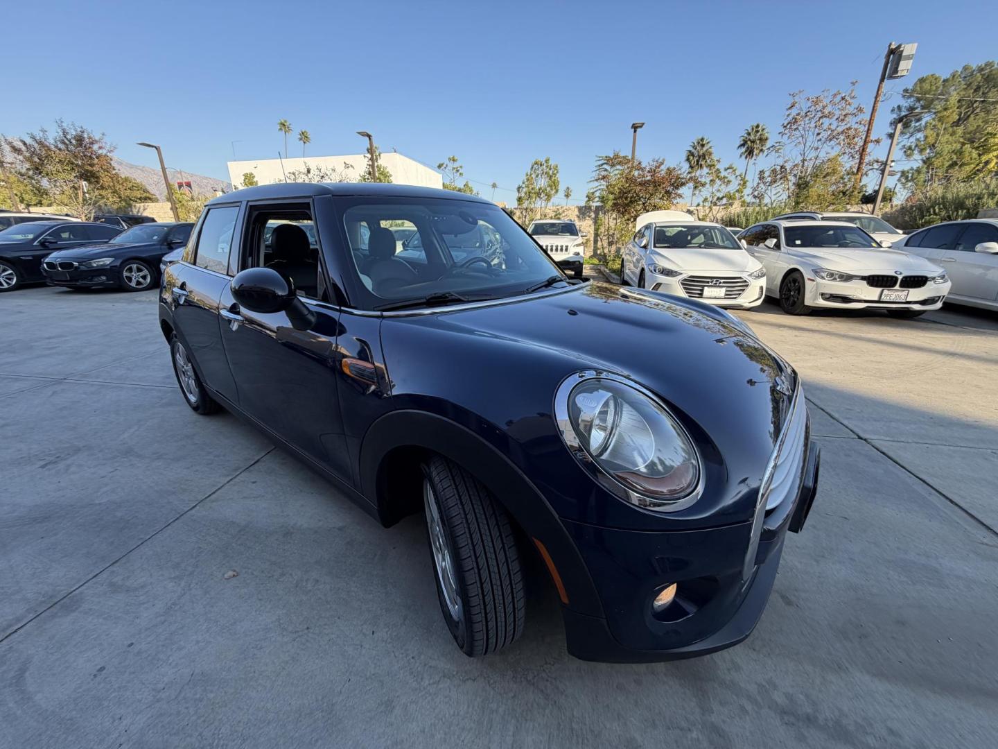 2015 Deep Blue Metallic /Black Mini Cooper Base (WMWXS5C50FT) with an 1.5L L3 engine, Automatic transmission, located at 30 S. Berkeley Avenue, Pasadena, CA, 91107, (626) 248-7567, 34.145447, -118.109398 - 2015 MINI Cooper Hardtop – Deep Blue Metallic | Style, Efficiency and Easy Financing in Pasadena Drive away in this stylish and fun-to-drive 2015 MINI Cooper Hardtop, finished in stunning Deep Blue Metallic with a black interior. Compact, sporty, and full of character, this MINI delivers worl- Photo#4